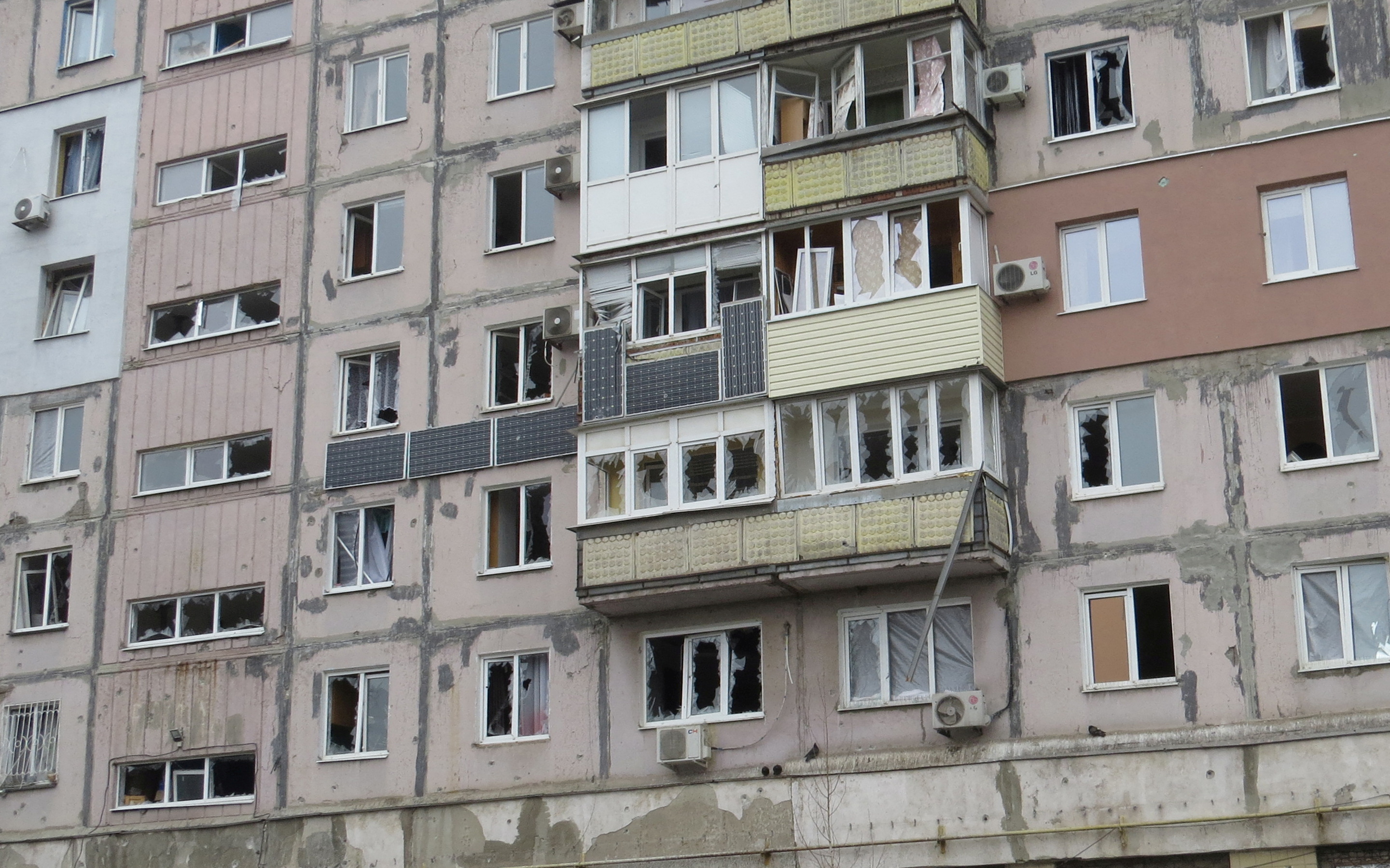 A view shows a damaged residential building in Mariupol