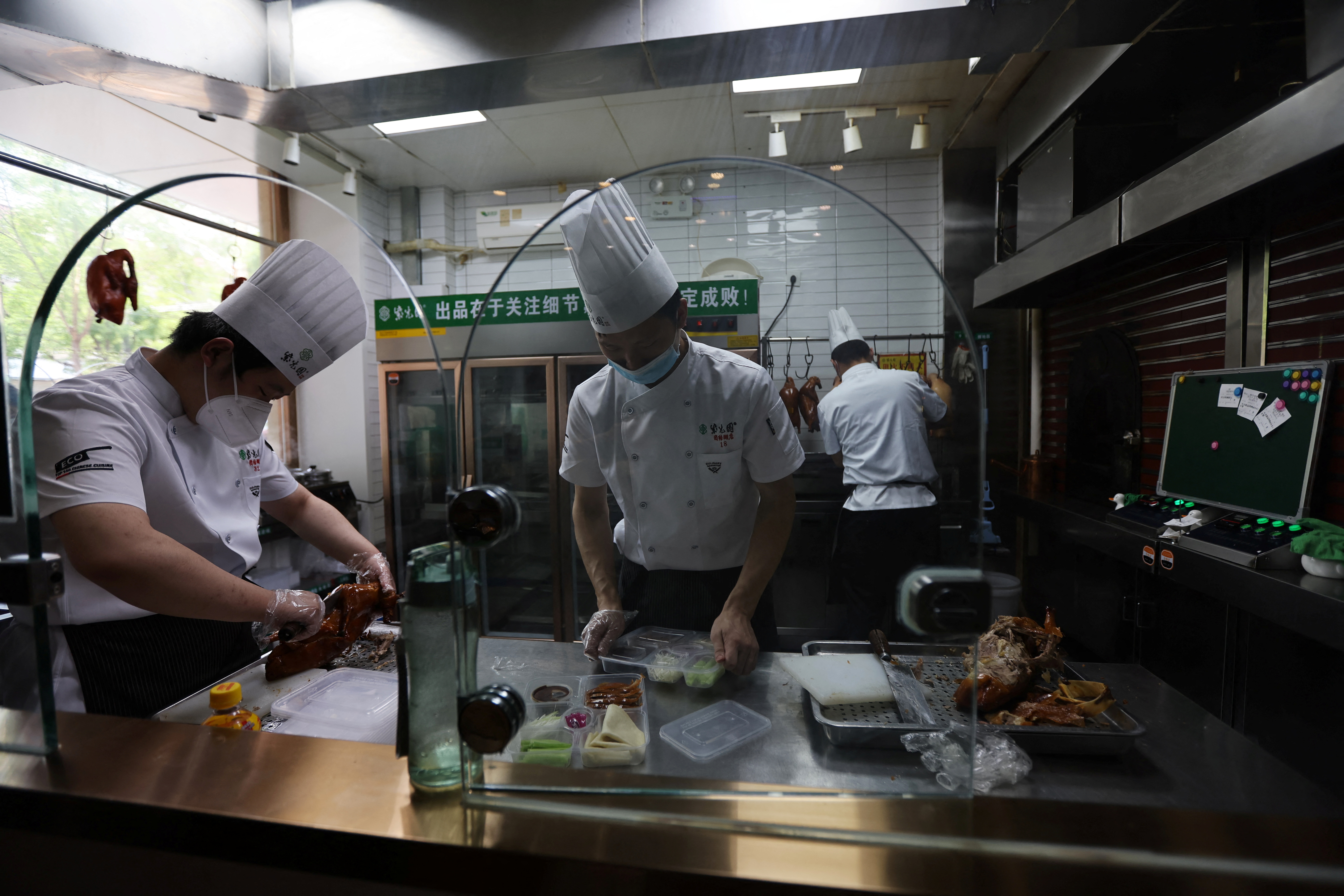 Restaurant prepares take-aways after the city banned dine-in services amid the COVID-19 outbreak in Beijing