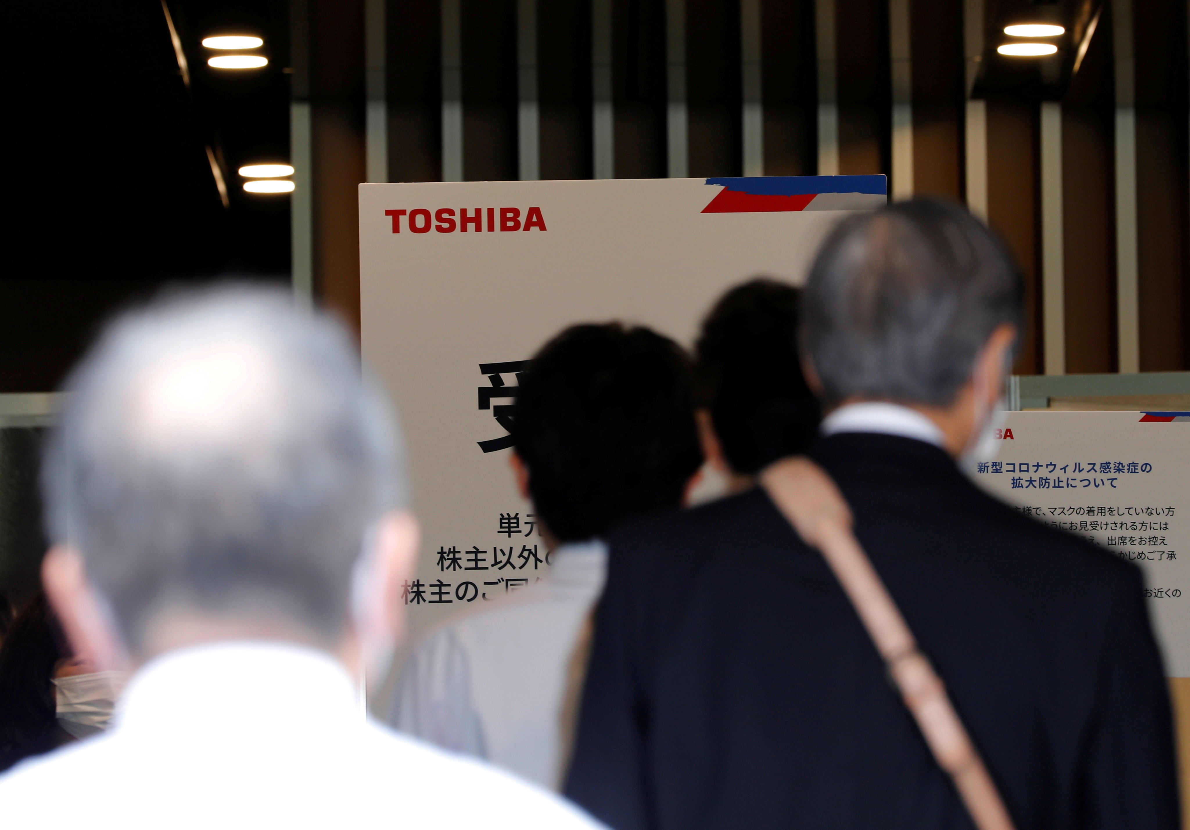 Shareholders enter a venue of Toshiba Corp's annual general meeting with its shareholders in Tokyo, Japan, June 25, 2021. REUTERS/Kim Kyung-Hoon 