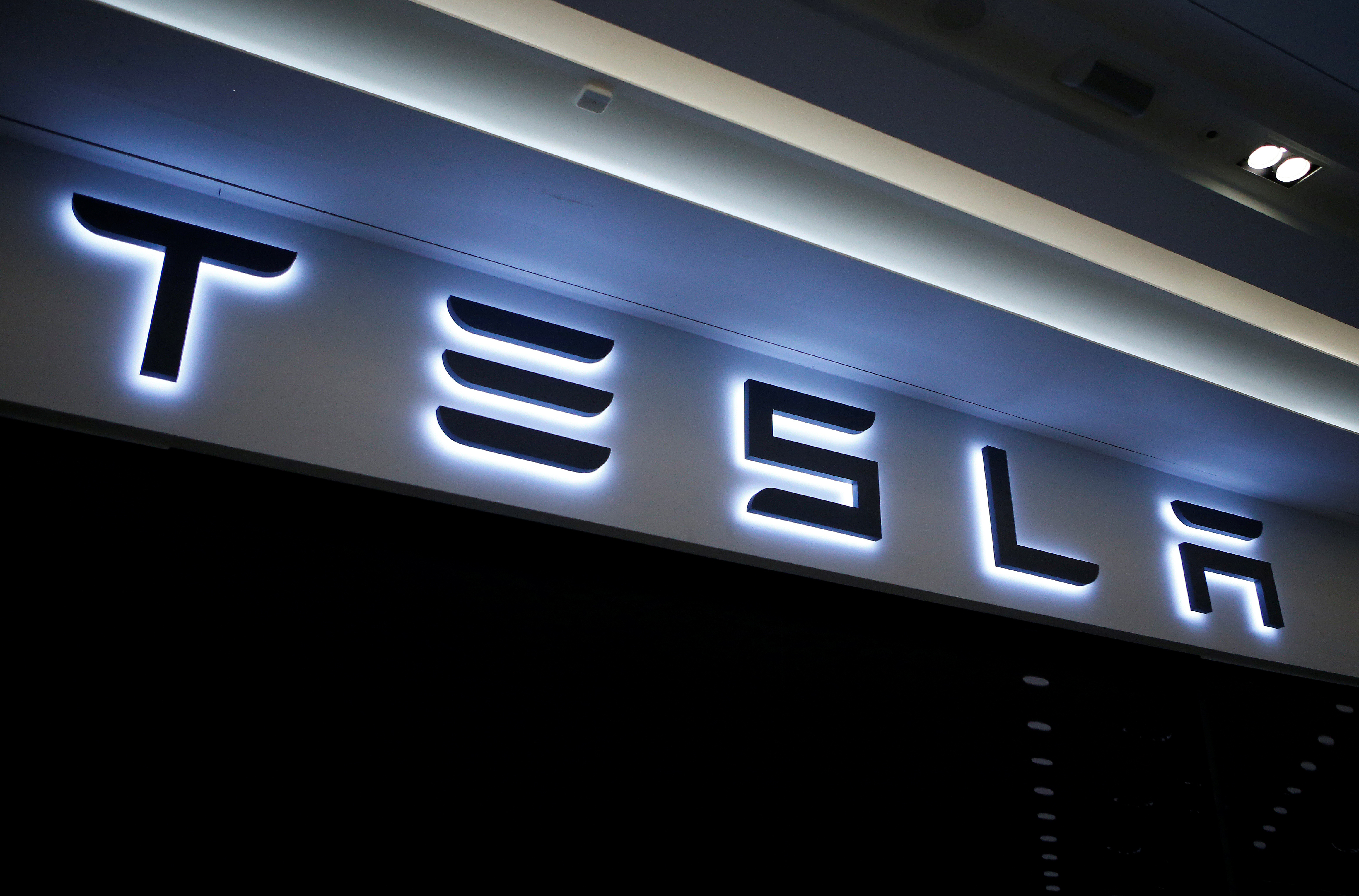 A Tesla logo is seen at its planned store in Hanam