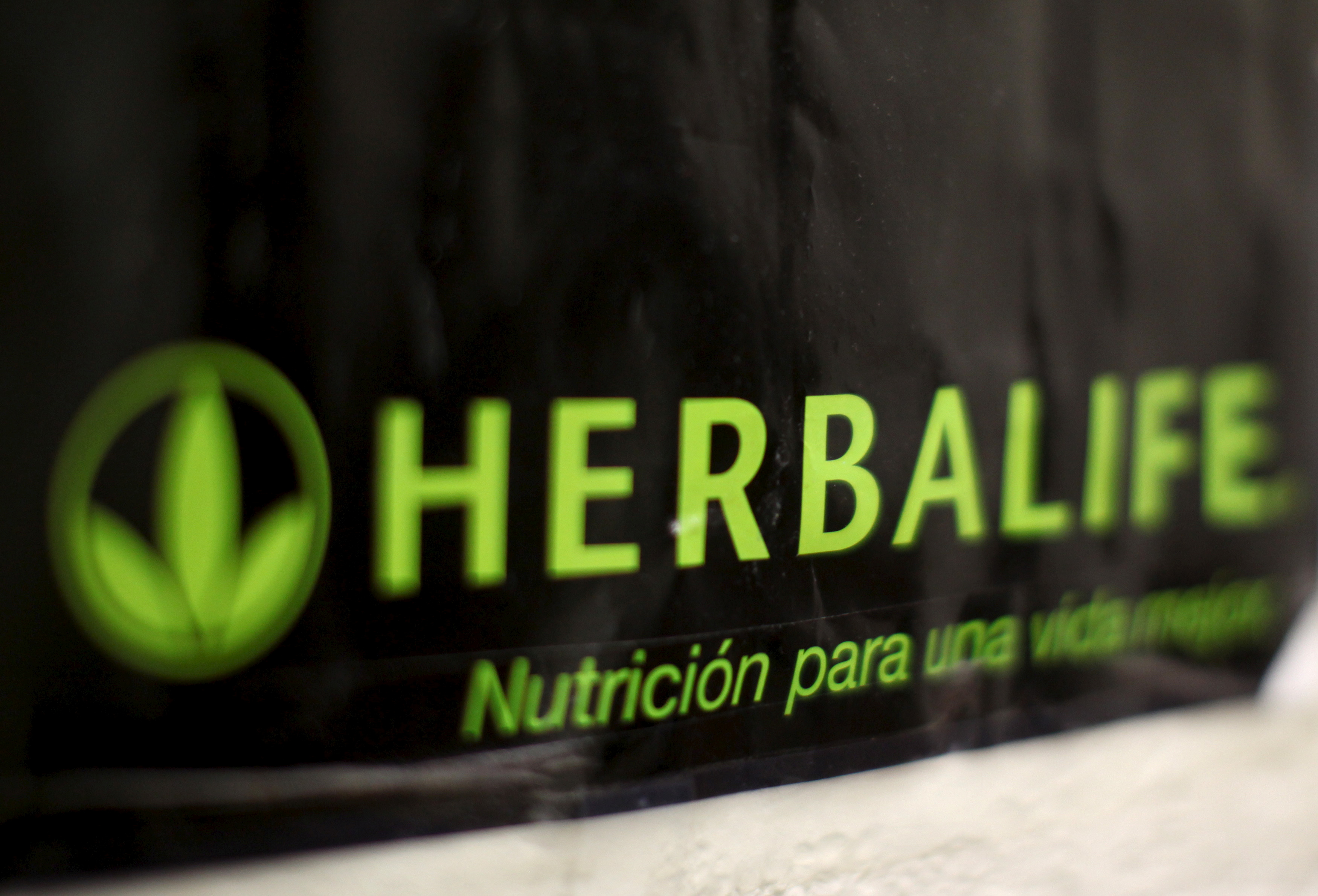 An Herbalife logo is shown on a poster at a clinic in the Mission District in San Francisco, California April 29, 2013.   REUTERS/Robert Galbraith
