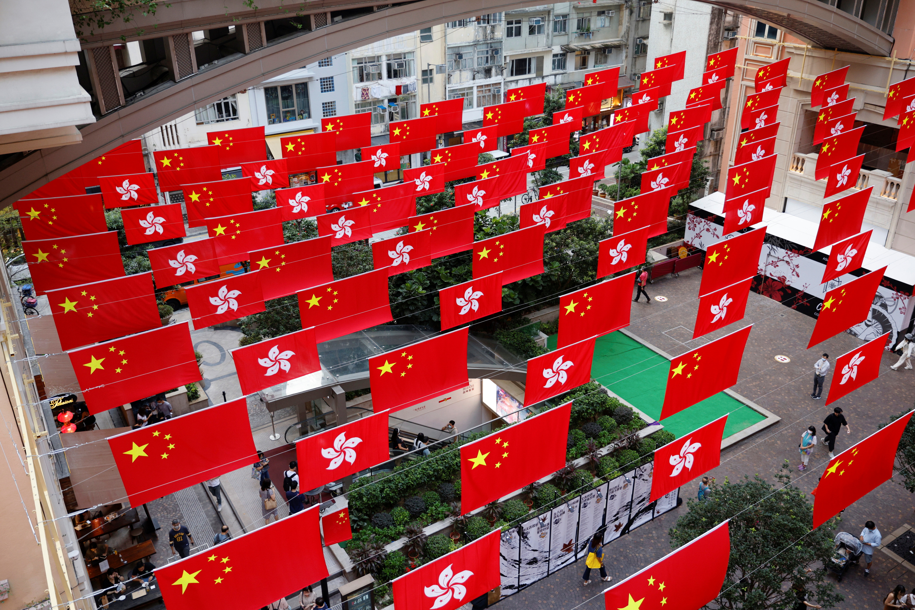 Chinese and Hong Kong flags are pictured outside a mall in Hong Kong