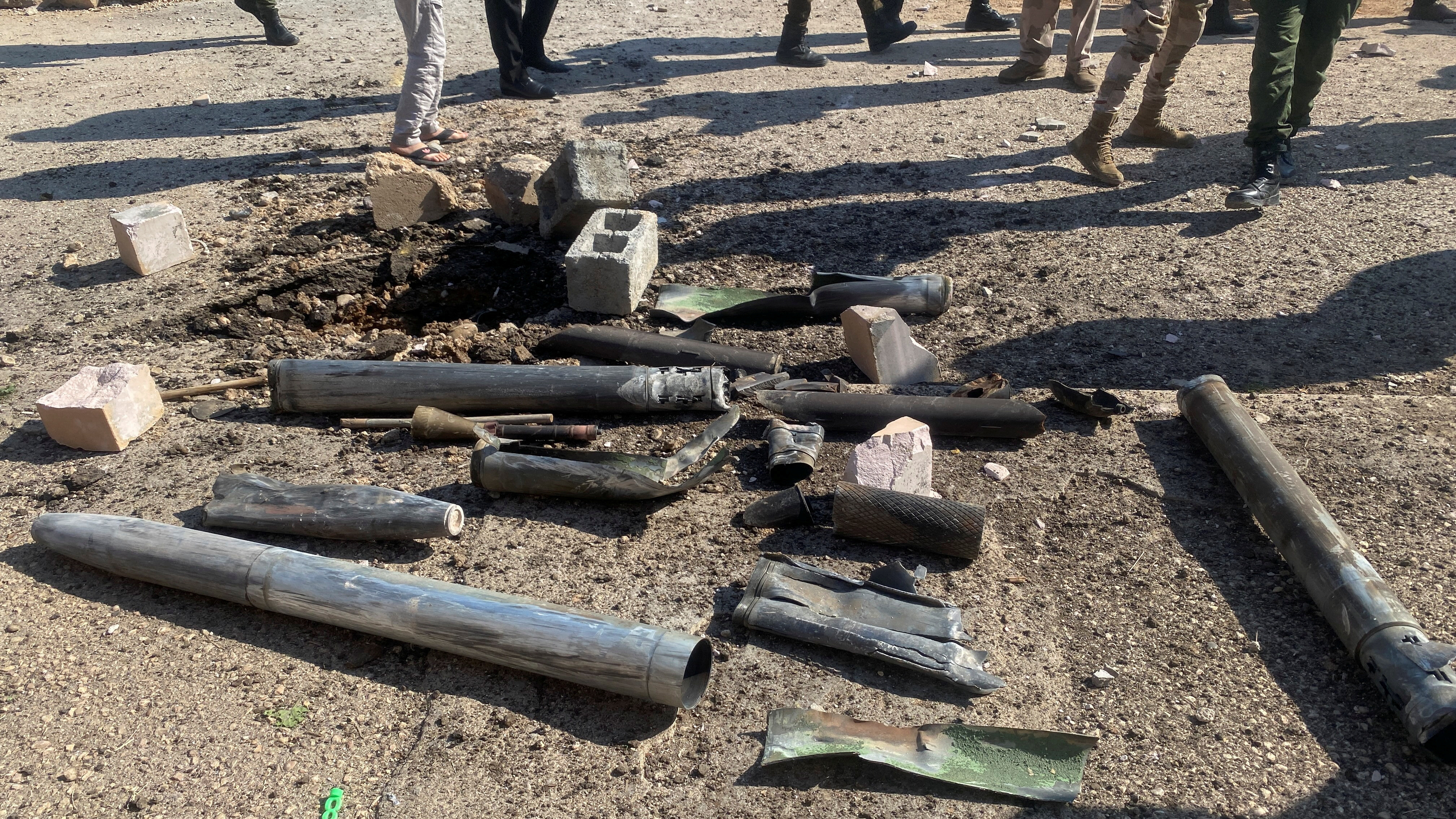Shell casings lie at the site of a U.S. airstrike in al-Qaim