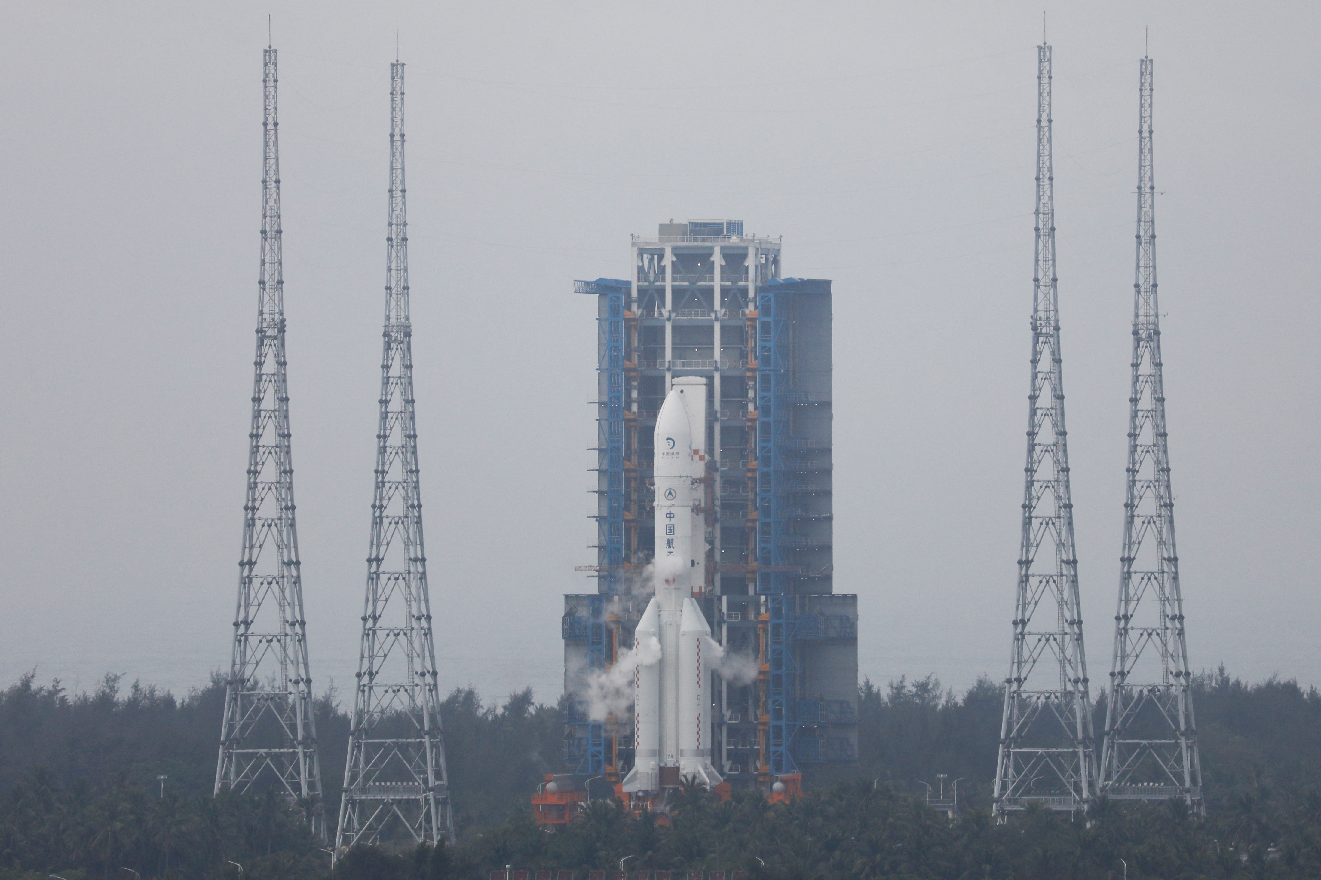 The Chang'e 6 lunar probe and the Long March-5 Y8 carrier rocket combination sit atop the launch pad at the Wenchang Space Launch Site in Hainan province