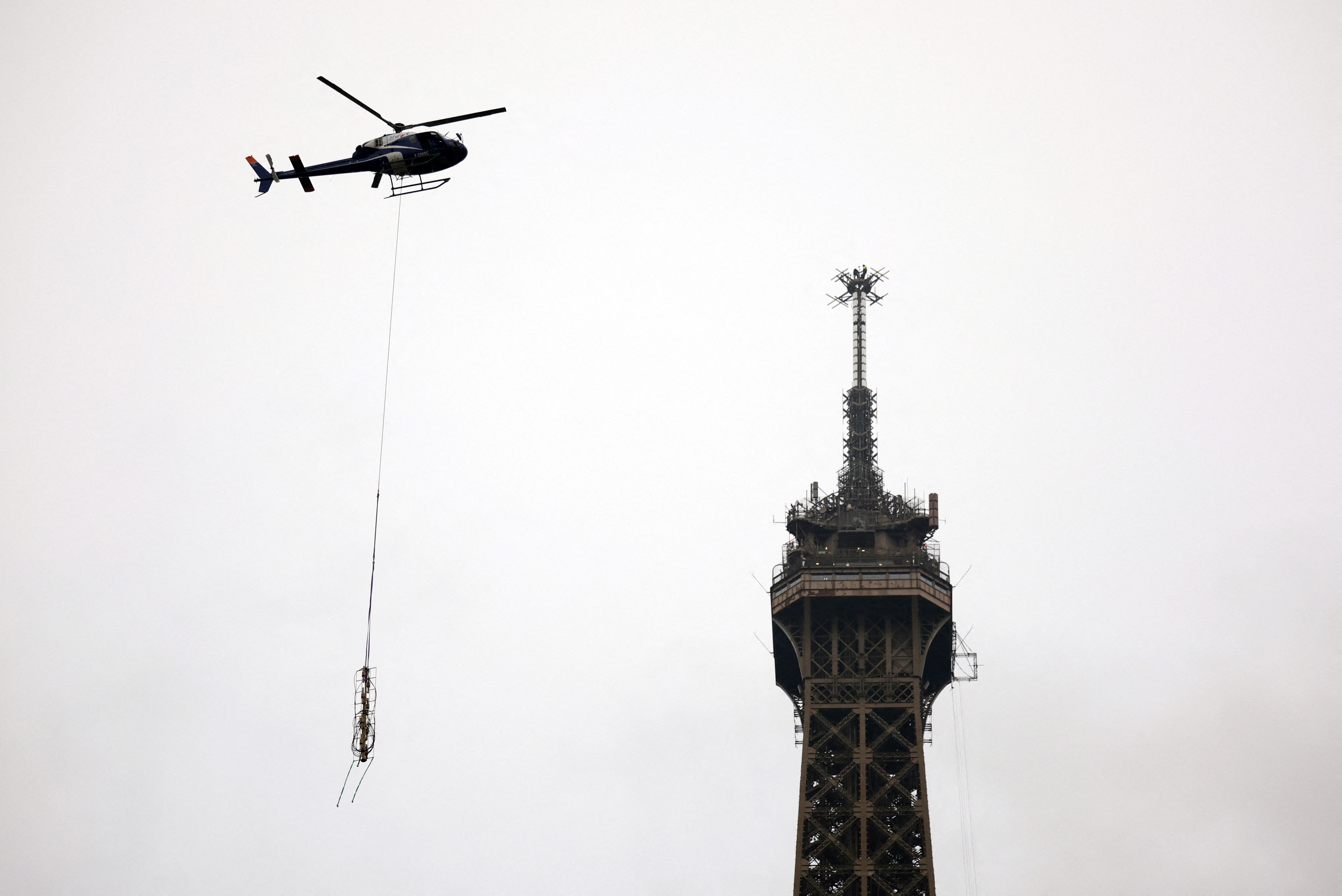 Installation of a new telecom transmission antenna on the Eiffel Tower in Paris