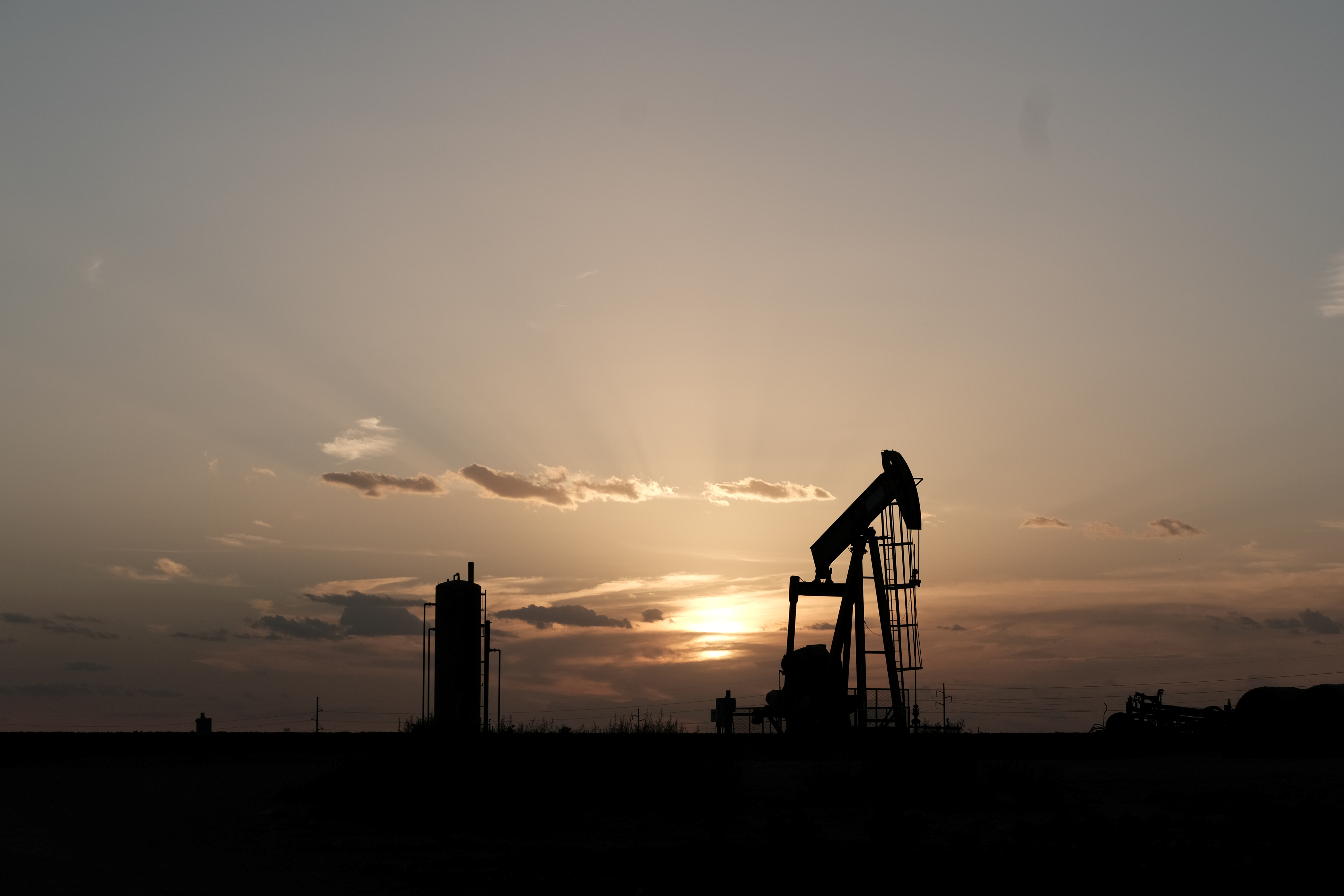 Oil pump jacks work at sunset near Midland, Texas, U.S., August 21, 2019. Picture taken August 21, 2019.  REUTERS/Jessica Lutz