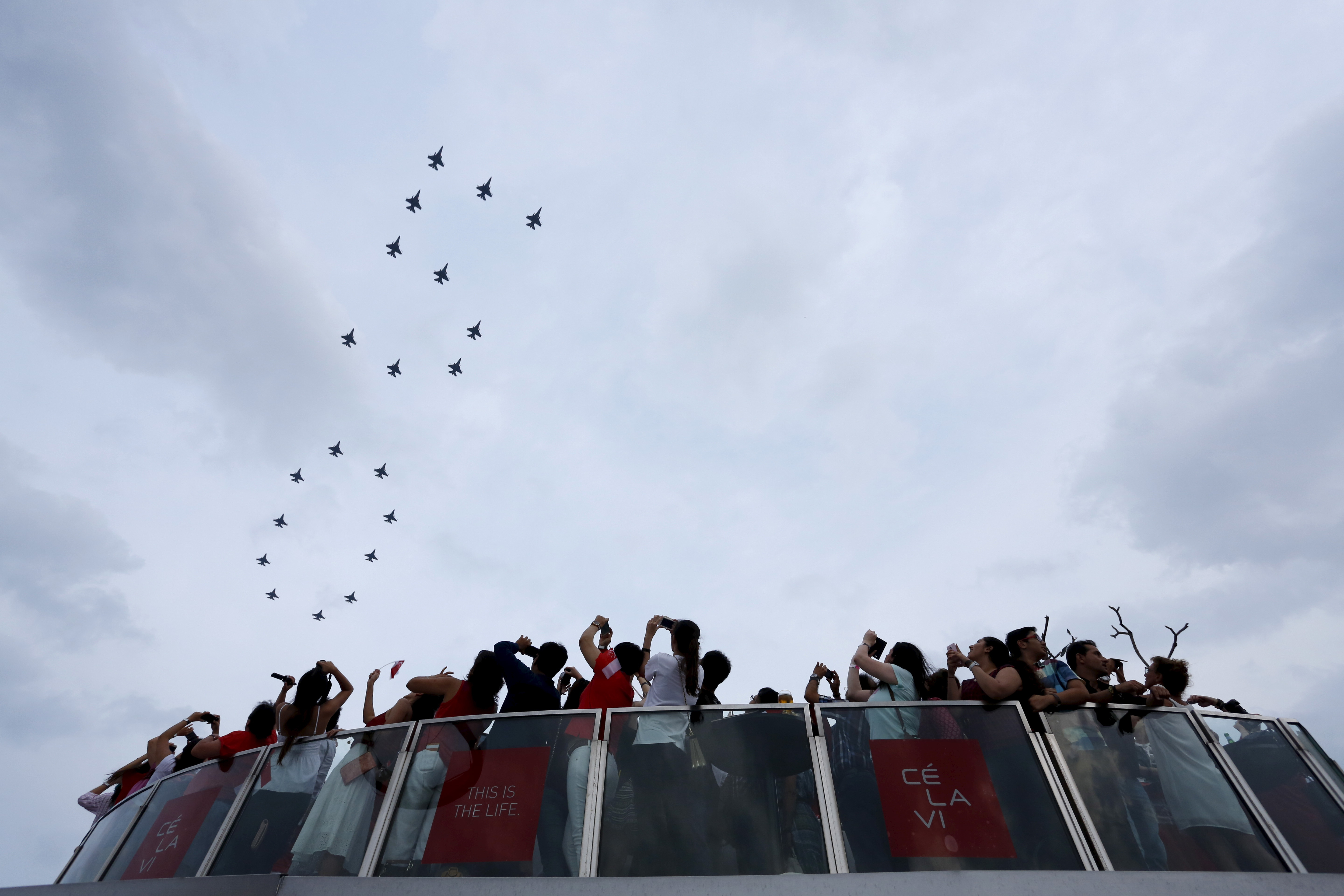 F-16 planes from the Singapore Air Force fly over Marina Bay Sands during Singapore's Golden Jubilee, in Singapore