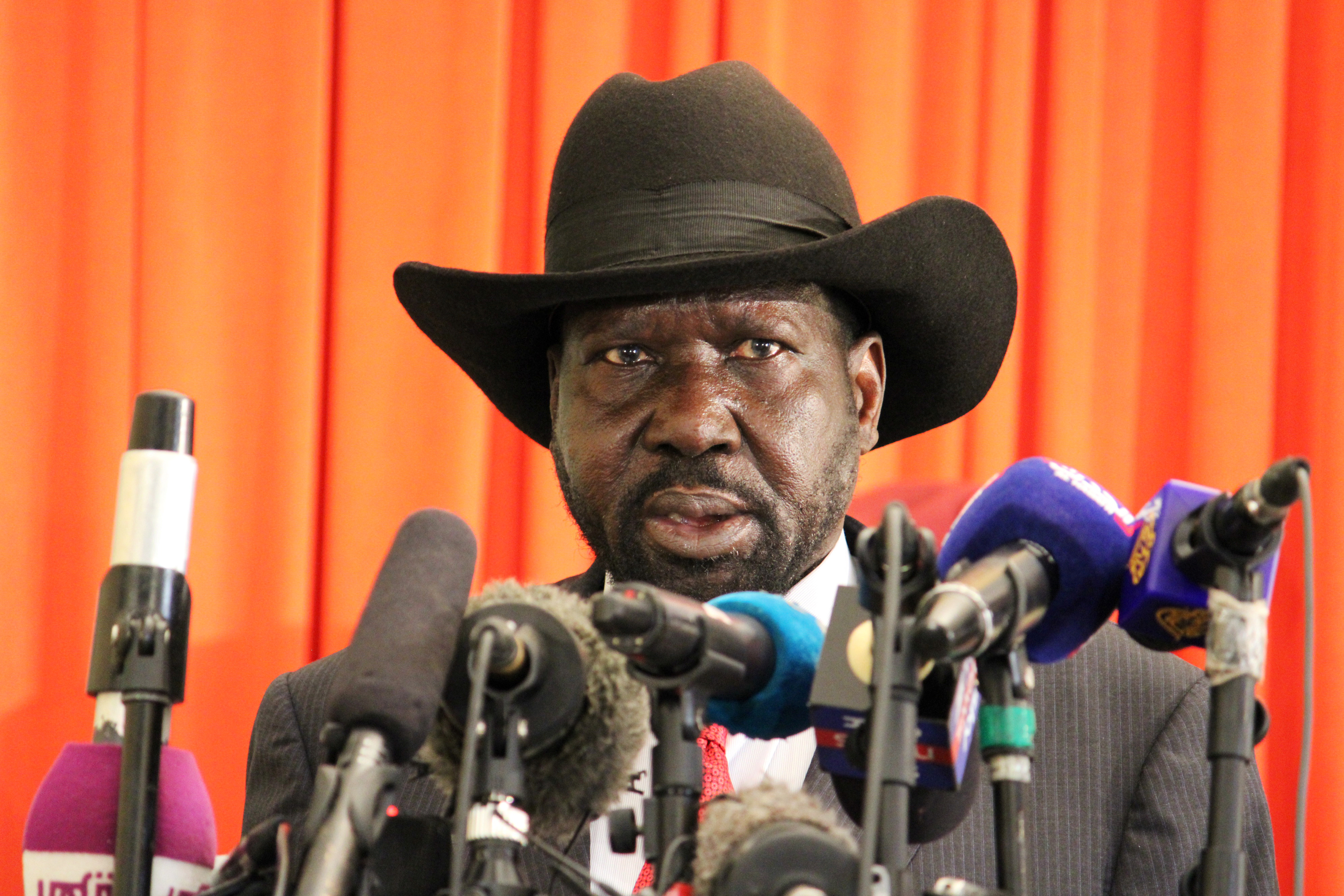 South Sudan's President Salva Kiir delivers a statement to the press after arriving at the Juba international airport