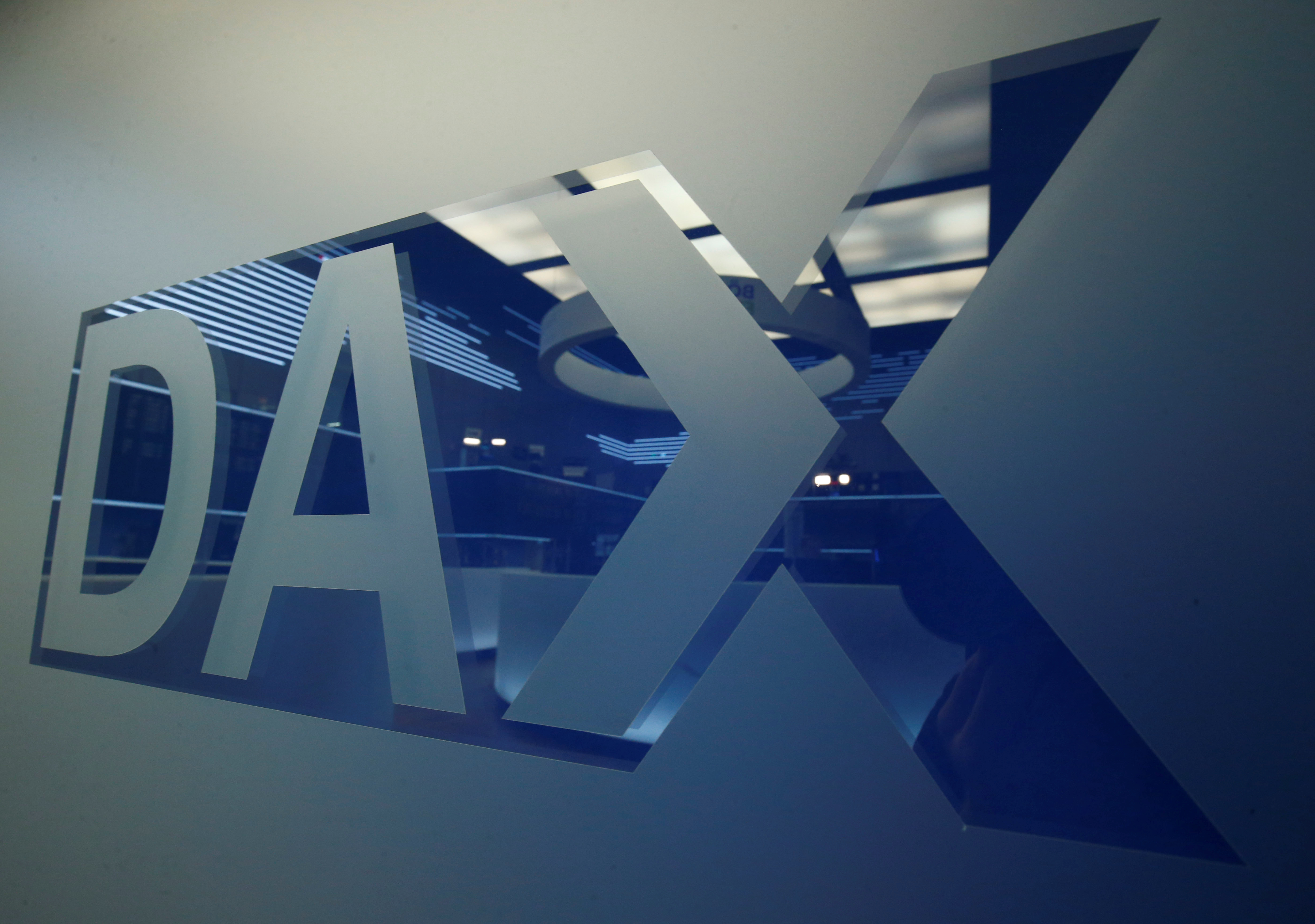 A DAX logo is pictured at the trading floor of the stock exchange in Frankfurt