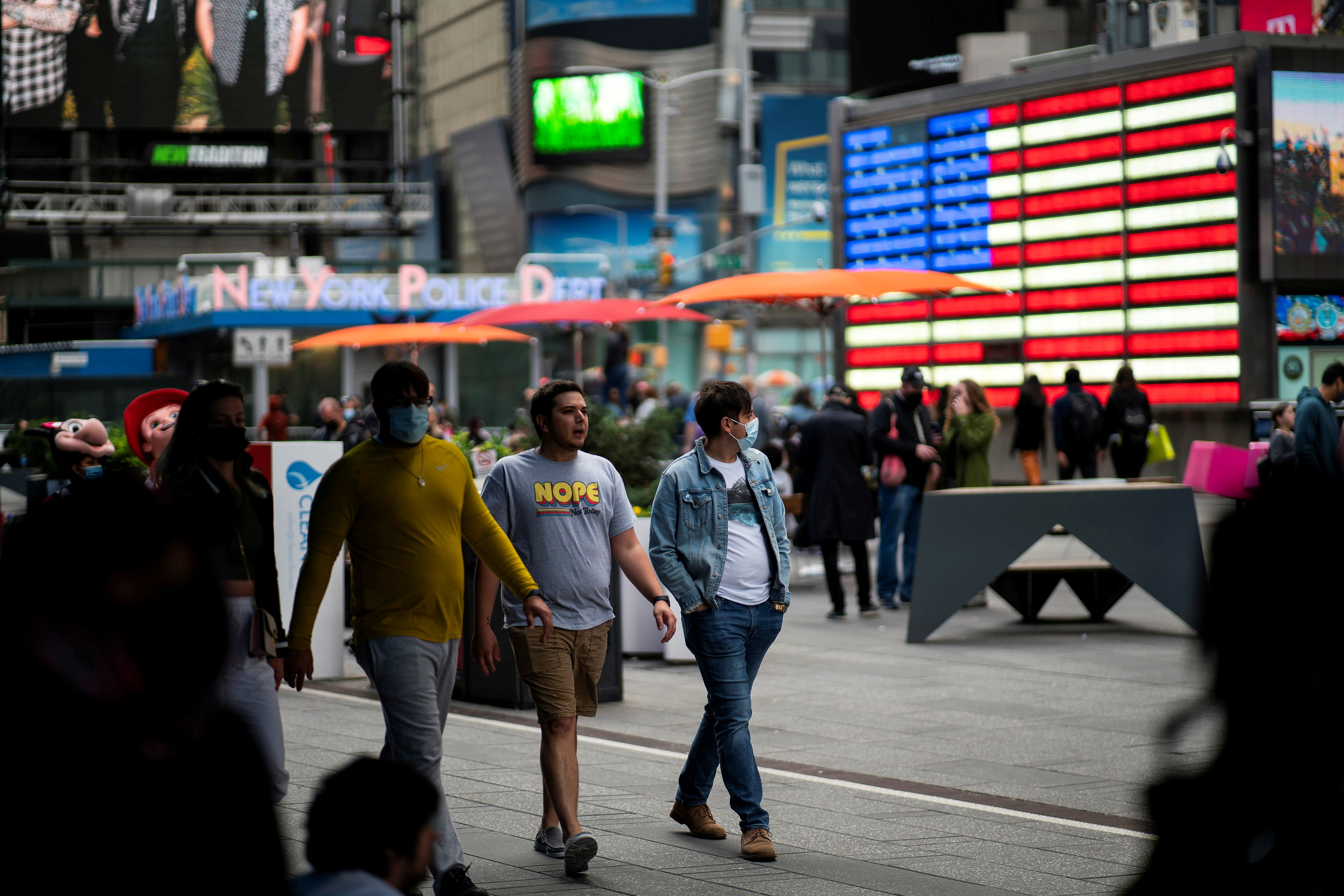 People make their way through Times Square, amid the coronavirus disease (COVID-19) pandemic, in Manhattan, New York City