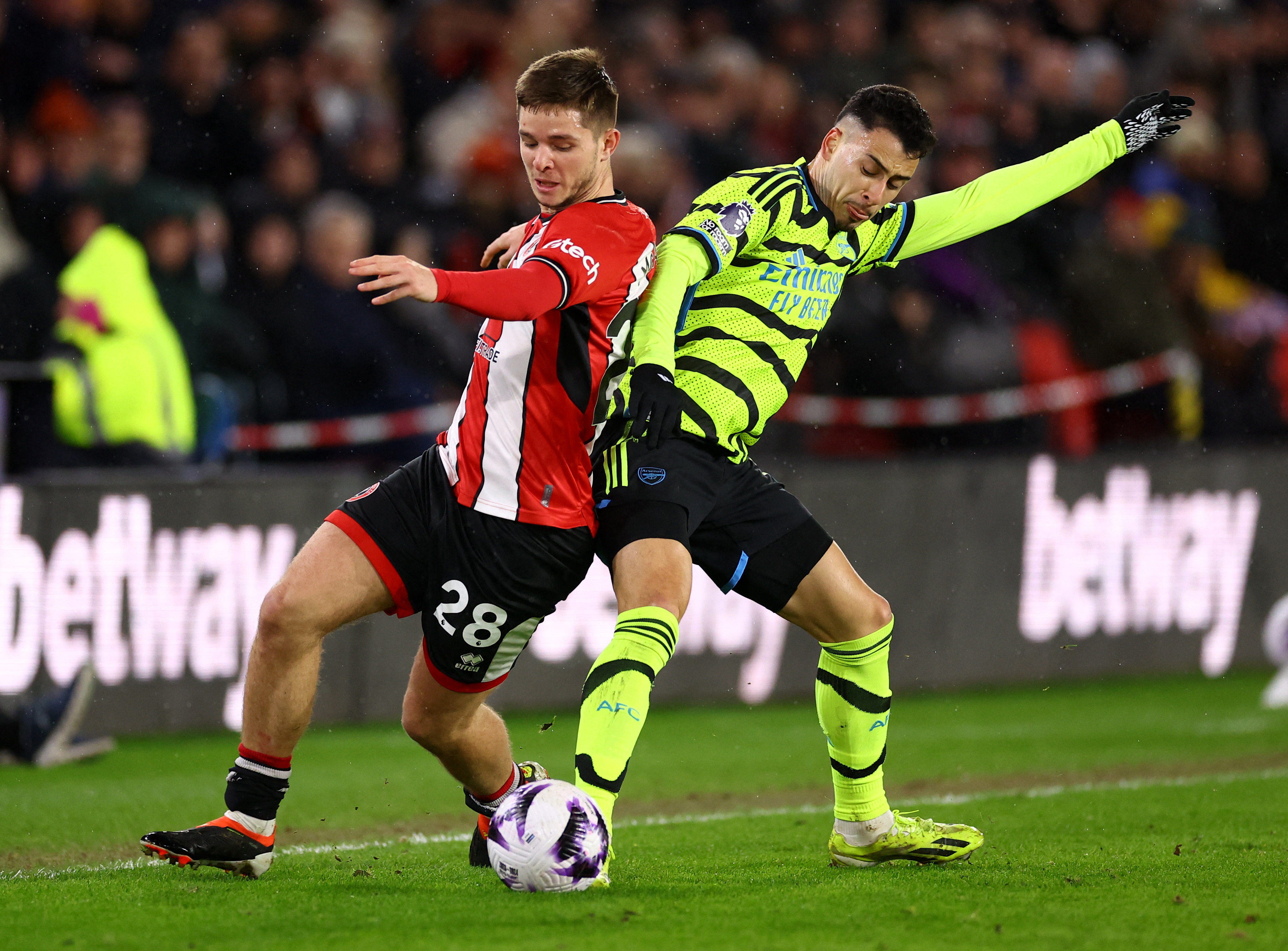 Soccer Football - Premier League - Sheffield United v Arsenal - Bramall Lane, Sheffield, Britain - March 4, 2024 Sheffield United's James McAtee in action with Arsenal's Gabriel Martinelli REUTERS/Carl Recine