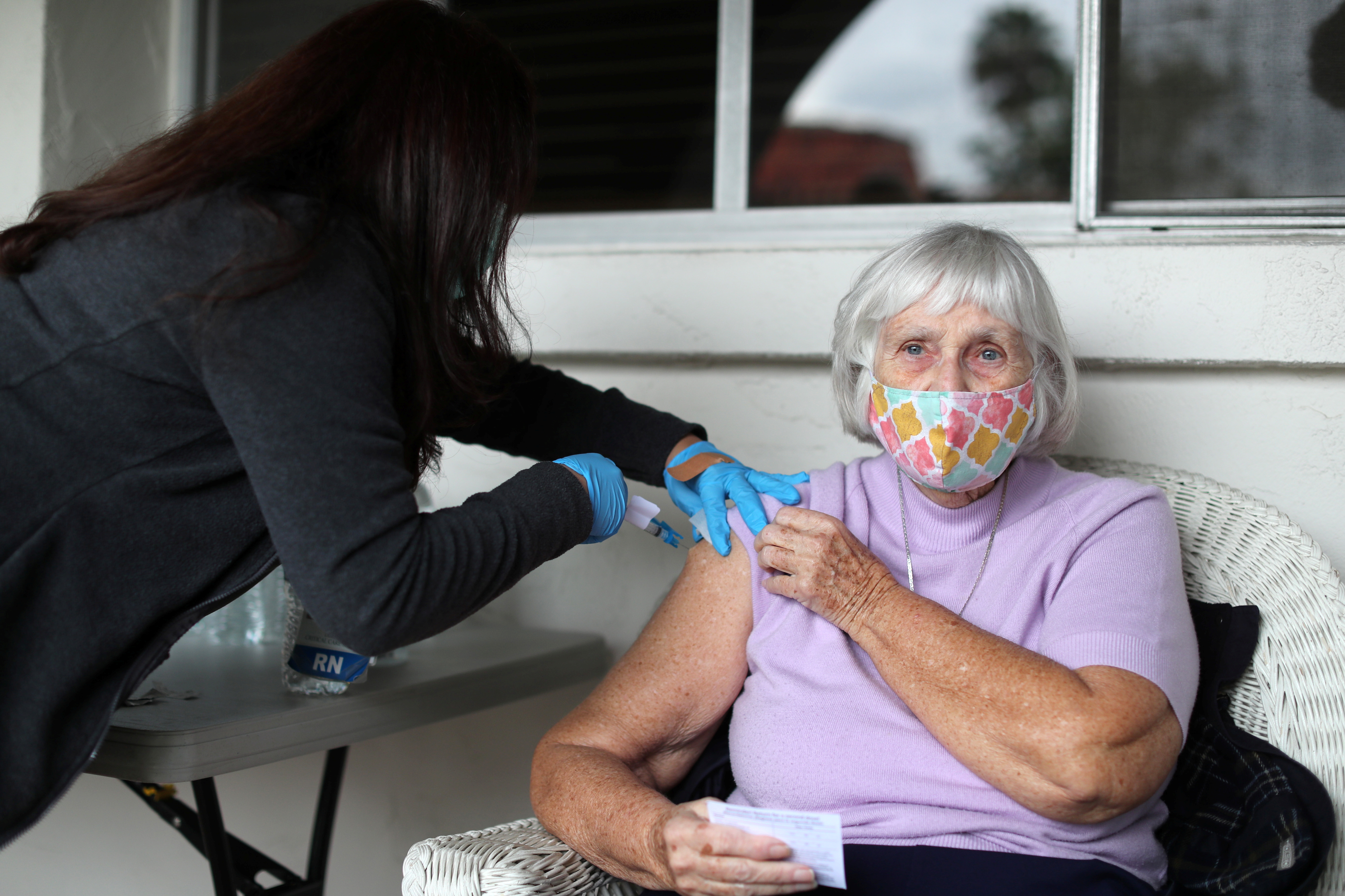 Sister Barbara Sullivan, 84, receives a coronavirus disease (COVID-19) vaccine at a vaccination drive for retired nuns at the Sisters of St. Joseph of Carondelet independent living center in Los Angeles, California, U.S., March 3, 2021. REUTERS/Lucy Nicholson