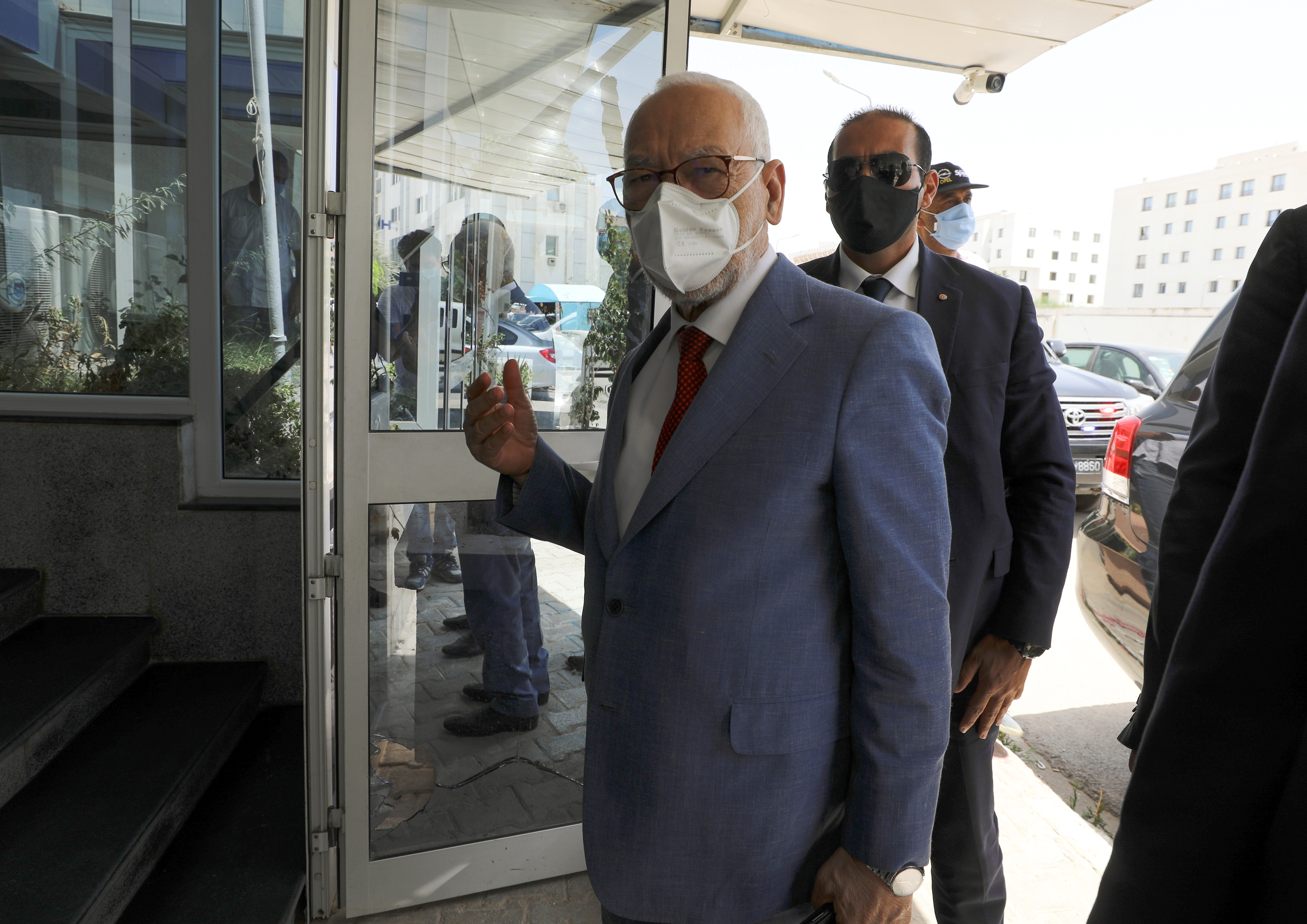 Parliament Speaker Rached Ghannouchi, head of the moderate Islamist Ennahda, arrives at the party's headquarters in Tunis