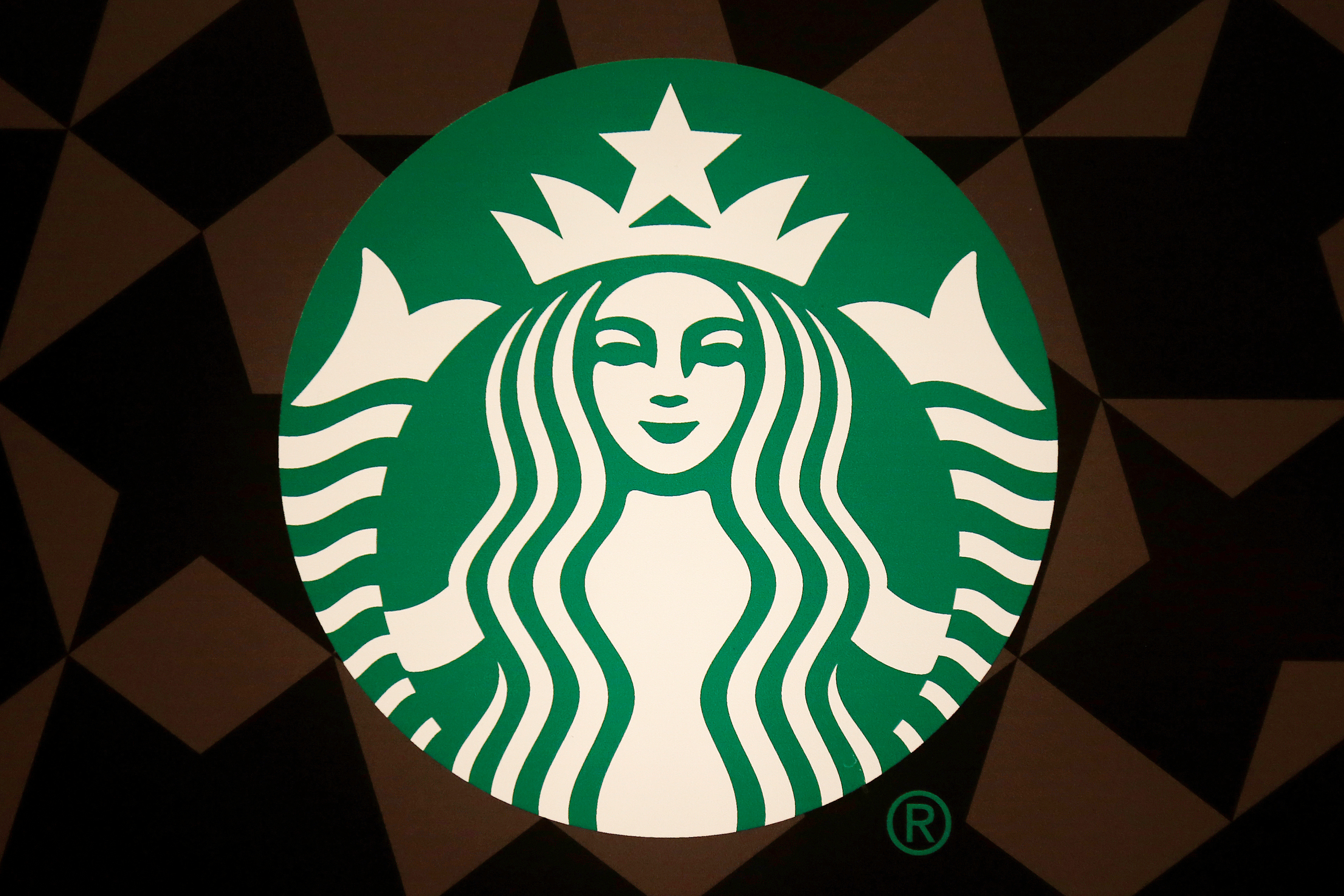 esgA Starbucks logo is pictured on the door of the Green Apron Delivery Service at the Empire State Building in New York