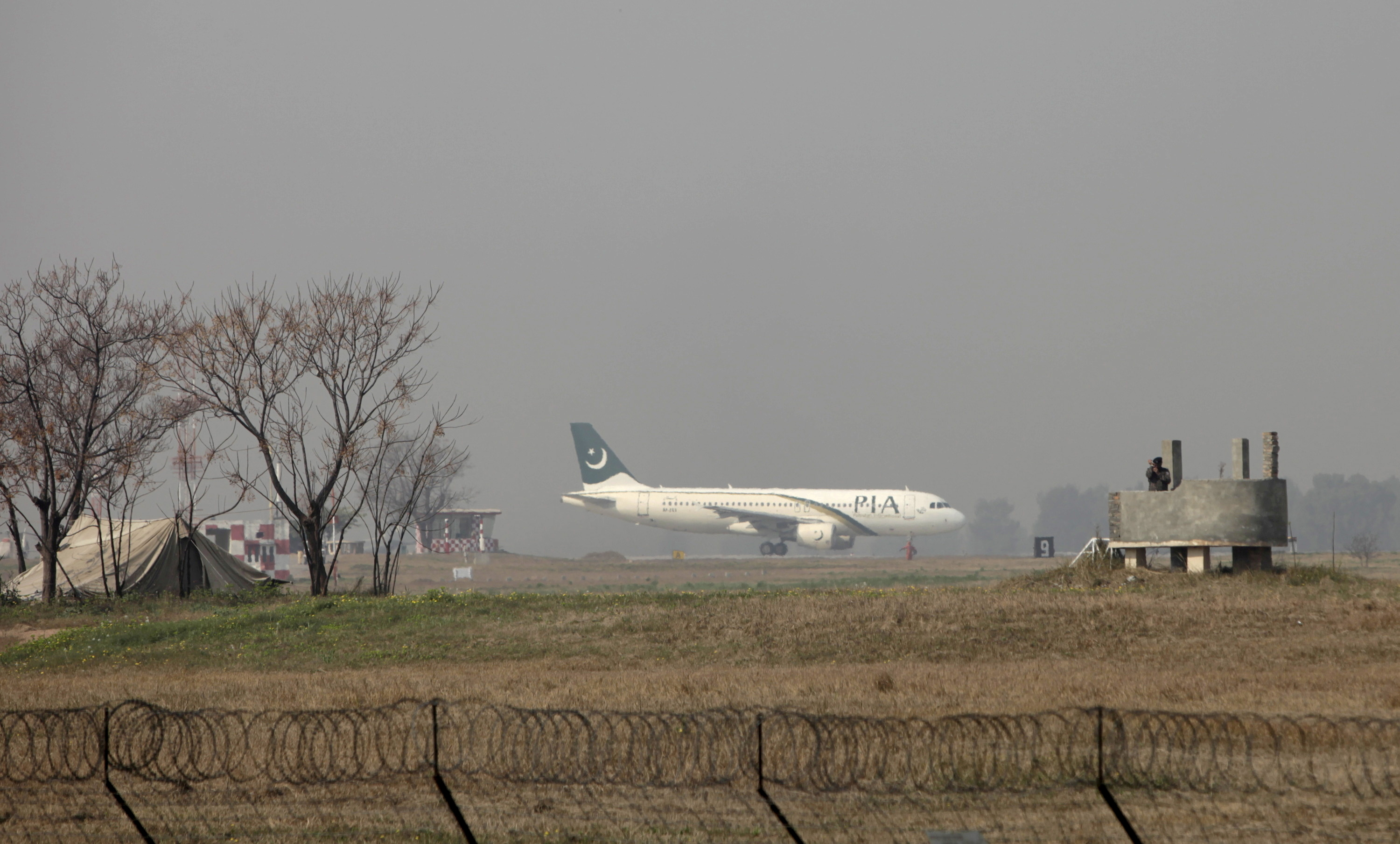 A Pakistan International Airlines (PIA) passenger plane prepares to take off from the Benazir International airport in Islamabad