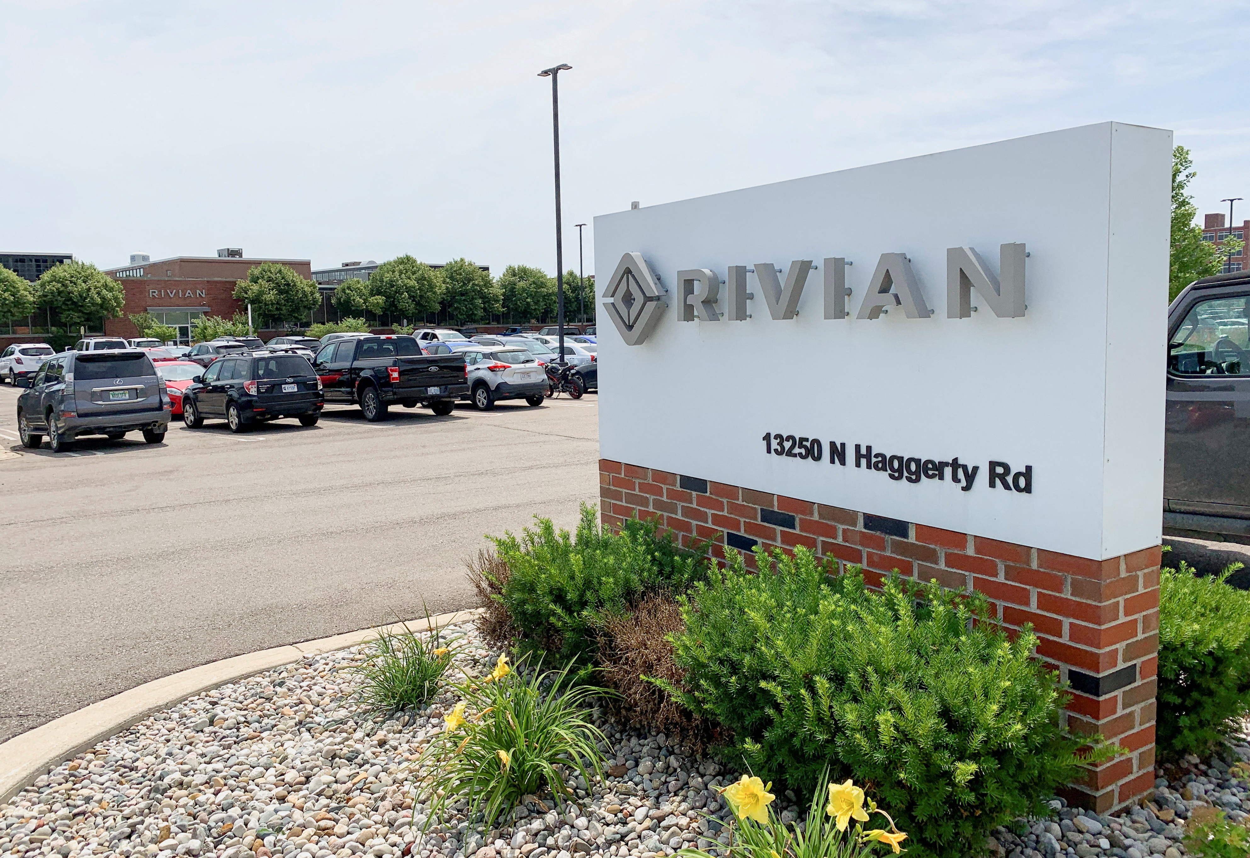 A Rivian Automotive sign outside the electric truck maker's facility, in Plymouth, Michigan