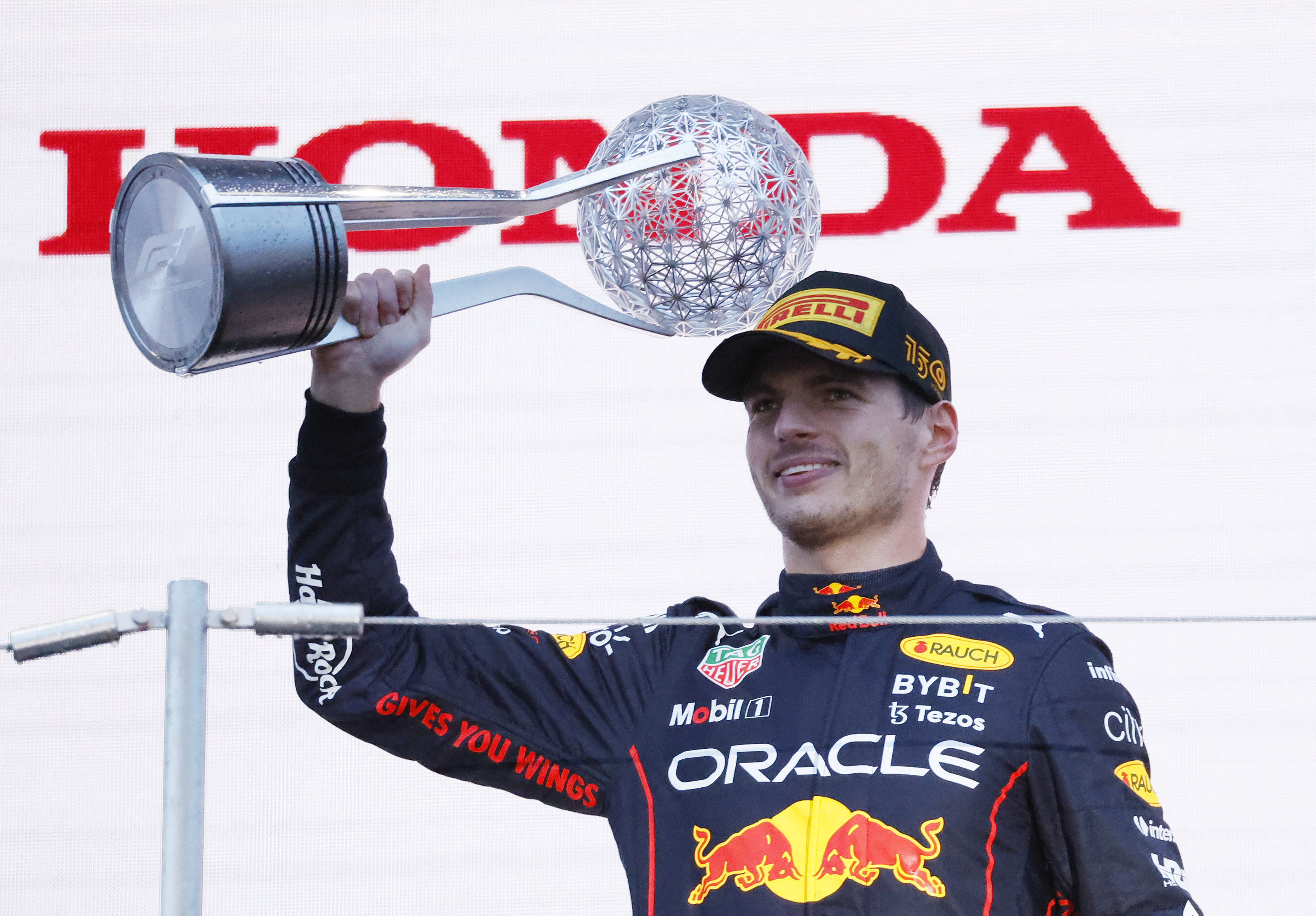 Verstappen wins chaotic, rain-shortened Japanese GP to clinch title