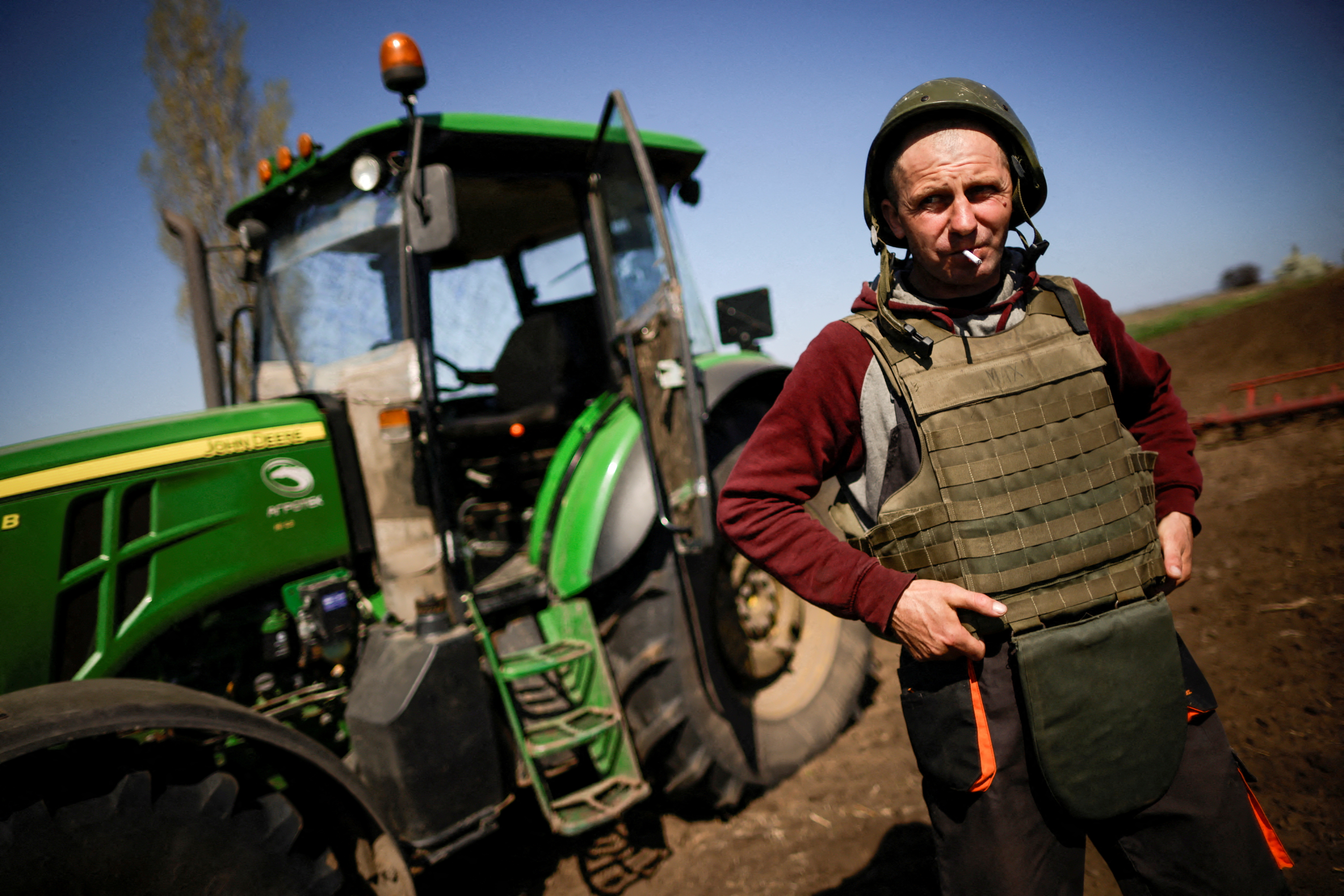 Ukrainian farmer wears body armour to plow frontline fields, in Zaporizhzhia