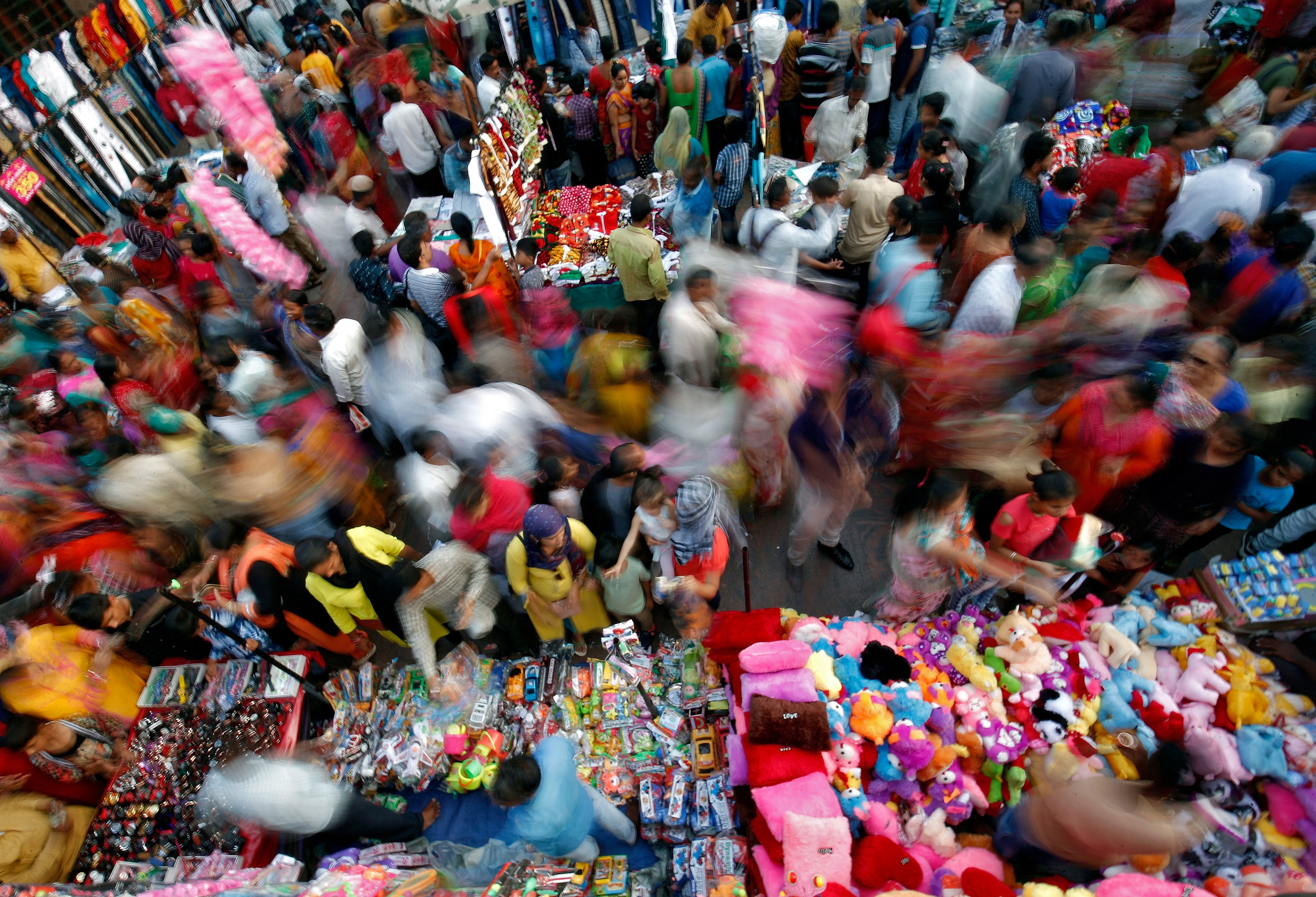 Shoppers crowd at a market place ahead of Diwali in Ahmedabad
