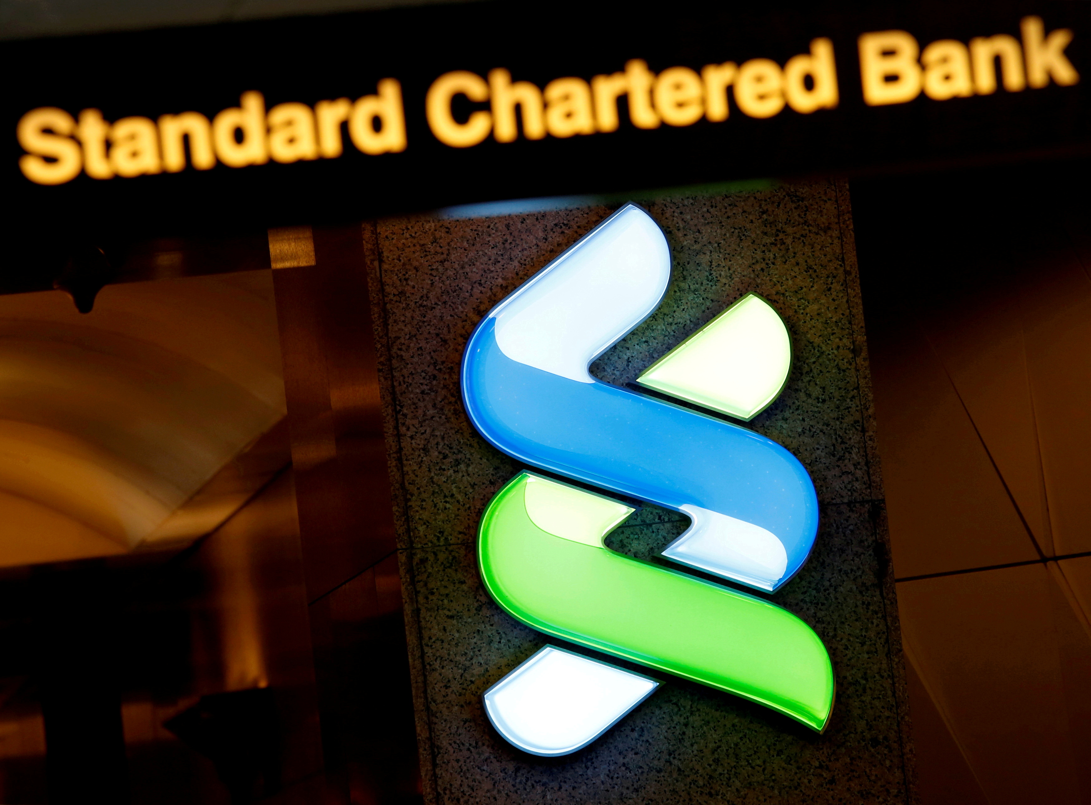 A logo of Standard Chartered is displayed at its main branch in Hong Kong