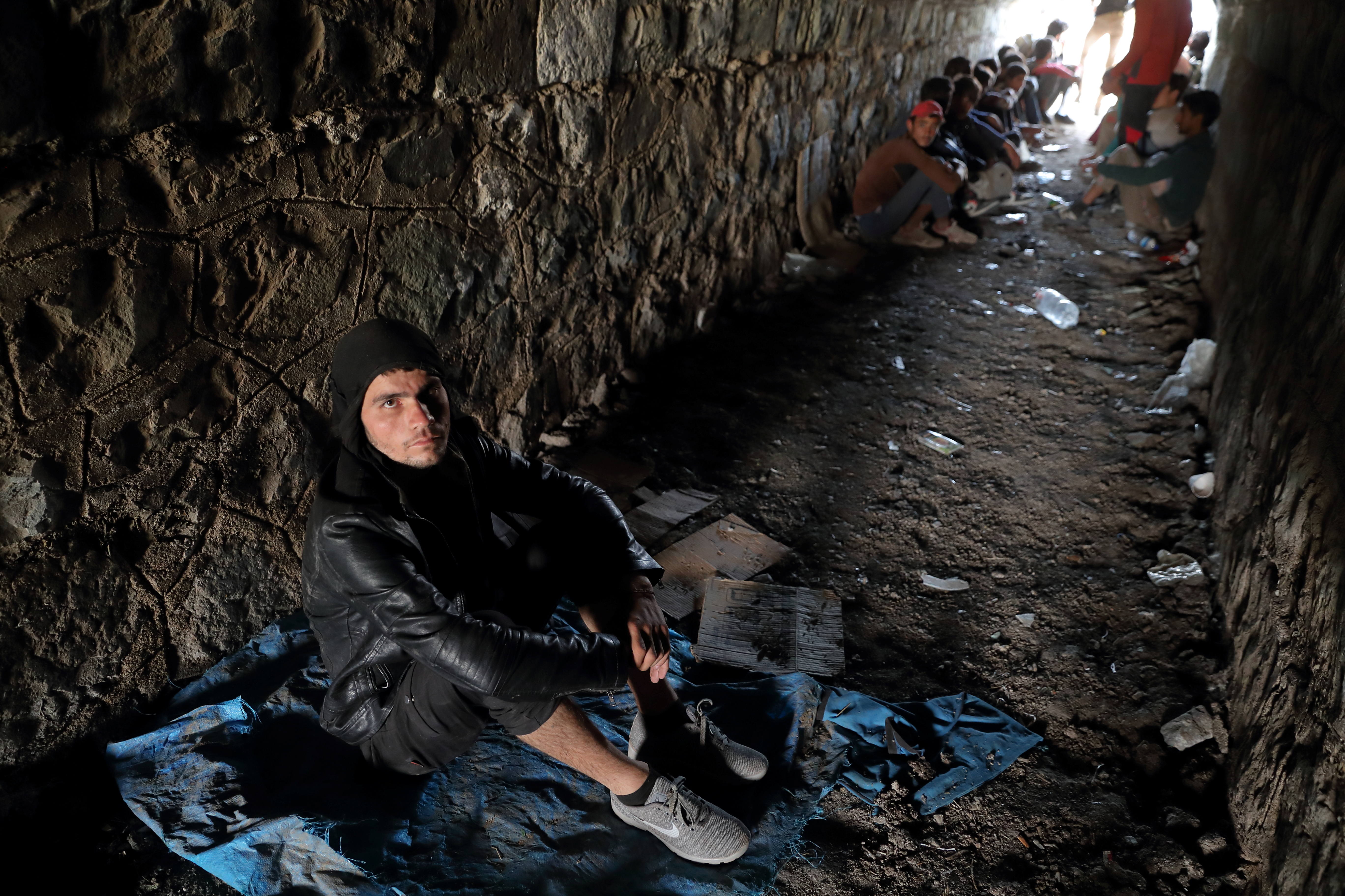 Afghan migrants hide from security forces in a tunnel under train tracks after crossing illegally into Turkey from Iran, near Tatvan in Bitlis province, Turkey August 23, 2021. Picture taken August 23, 2021. REUTERS/Murad Sezer