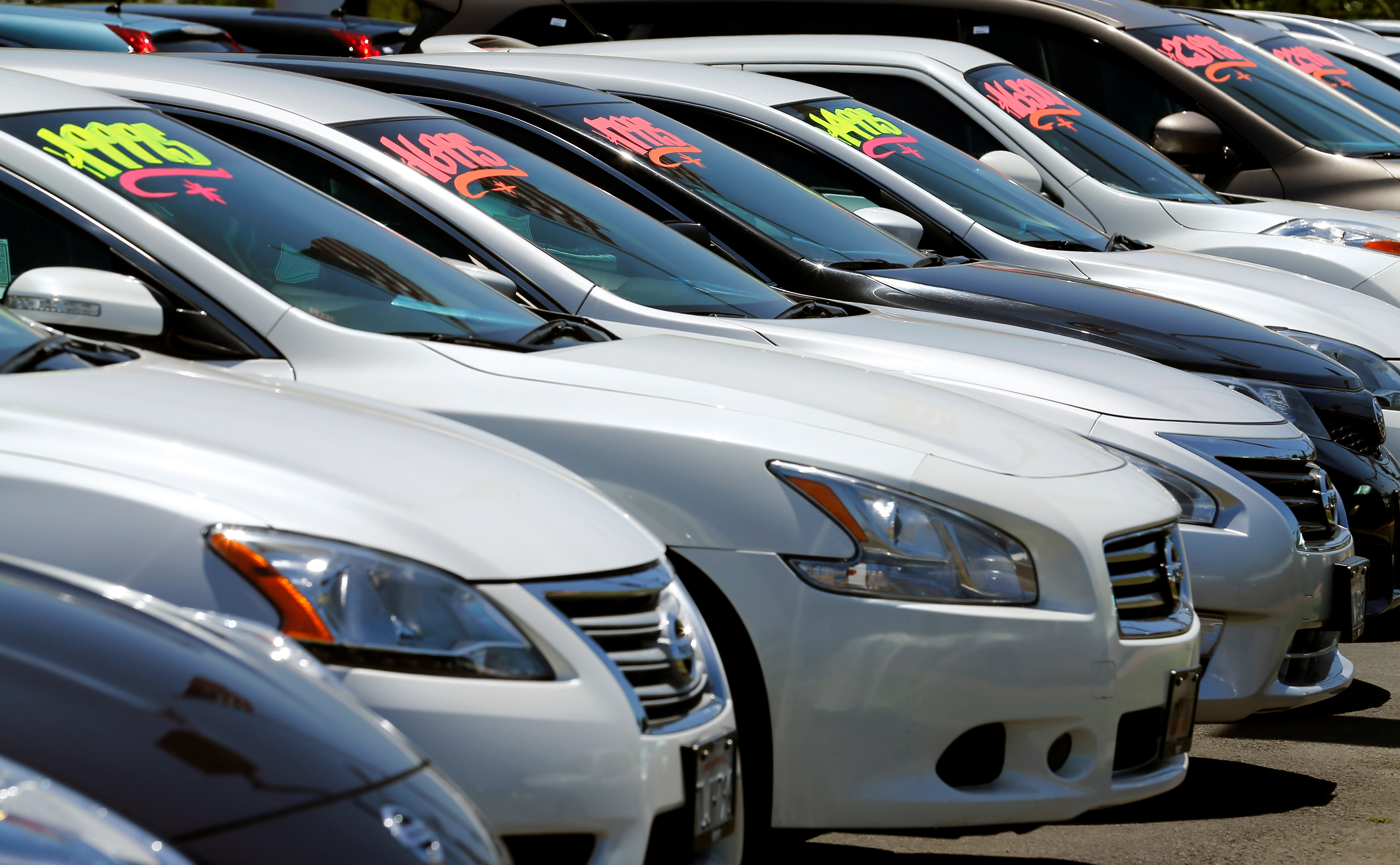 FILE PHOTO - Automobiles are shown for sale at a car dealership in Carlsbad, California