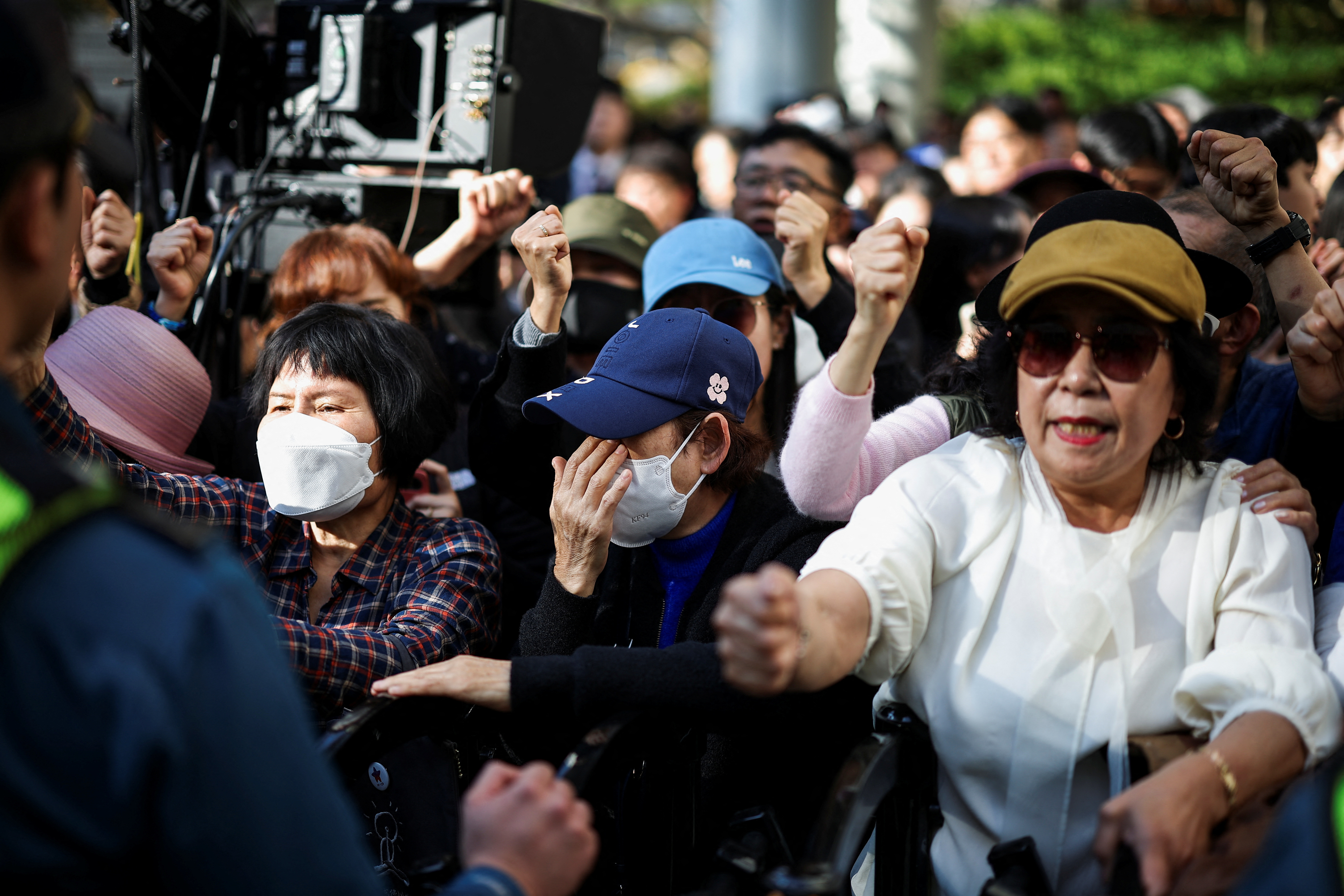 Supporters of South Korea's main opposition Democratic Party leader Lee Jae-myung react at a court in Seoul