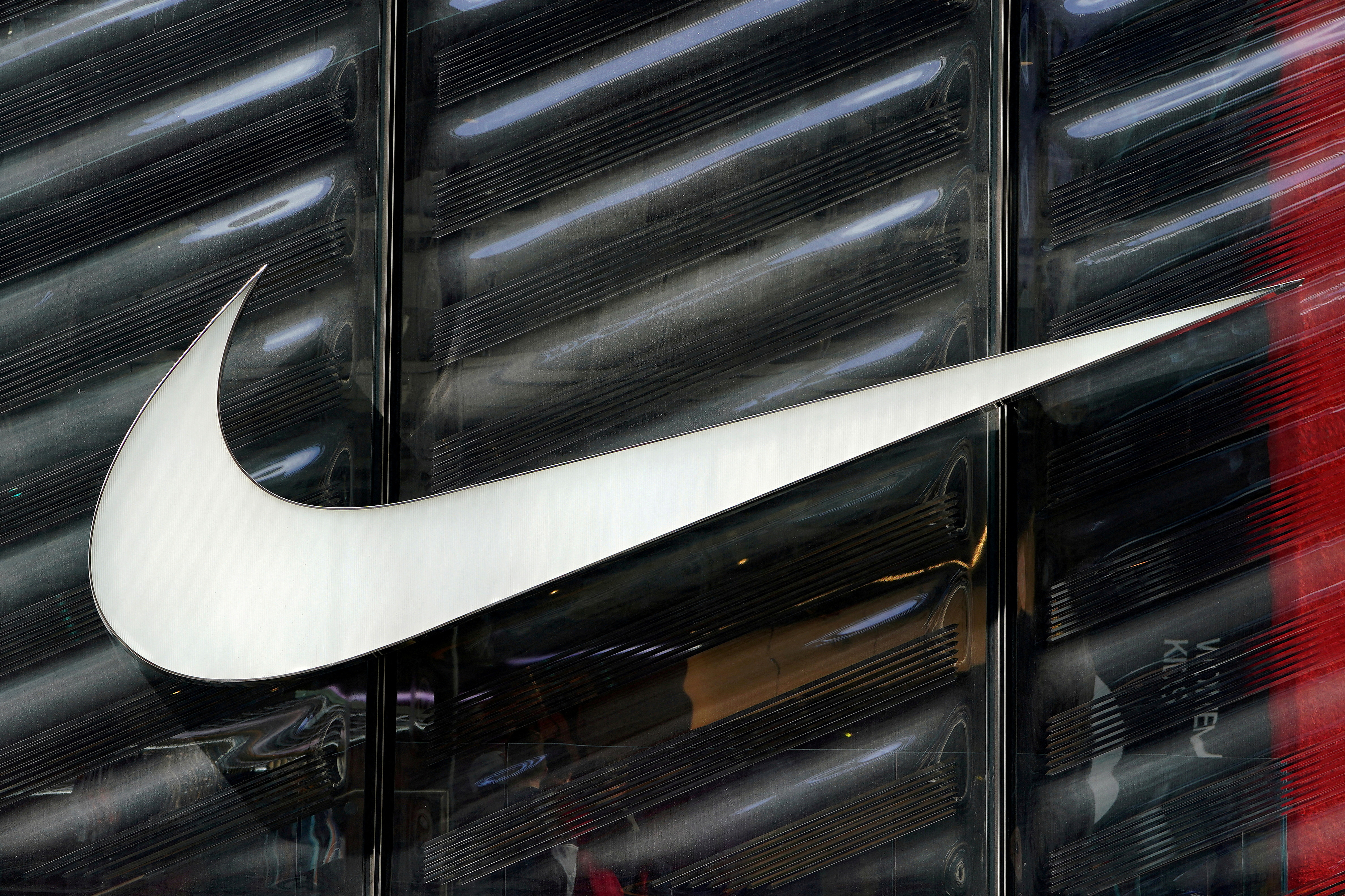 FILE PHOTO: FILE PHOTO: The Nike swoosh logo is seen outside the store on 5th Avenue in New York