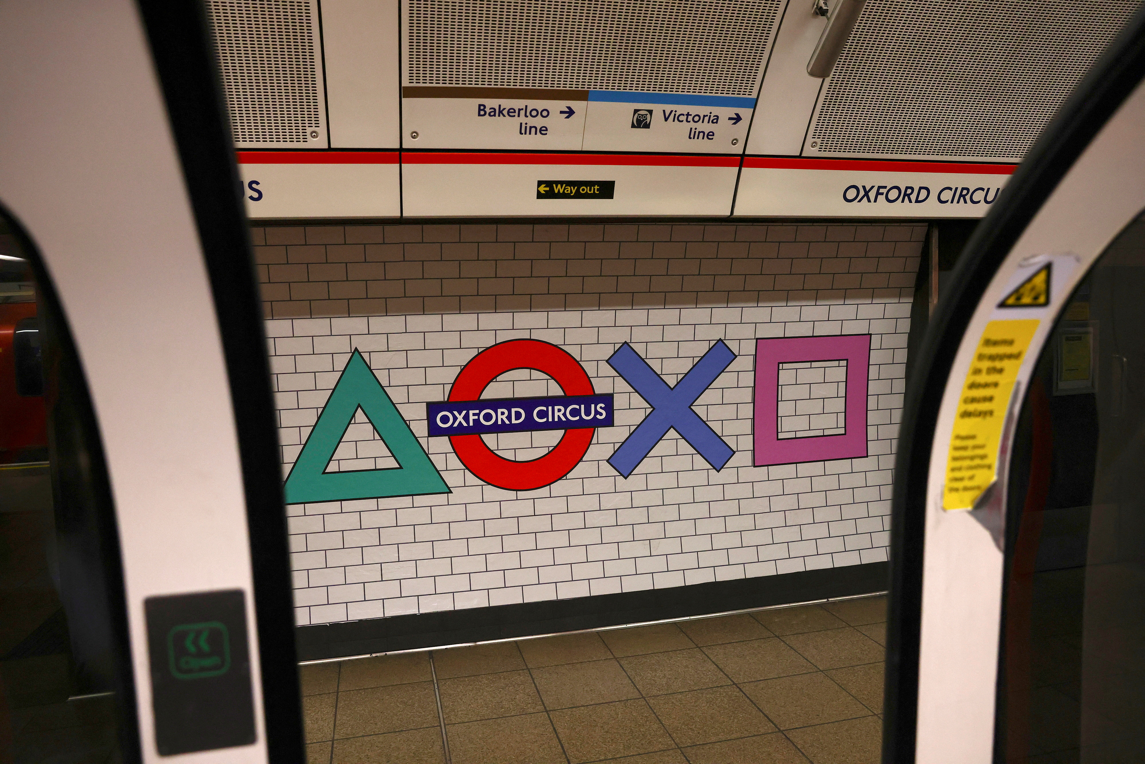 Sony Playstation 5 branding is displayed replacing the traditional Oxford Circus underground logo on the platform of the tube station, in London