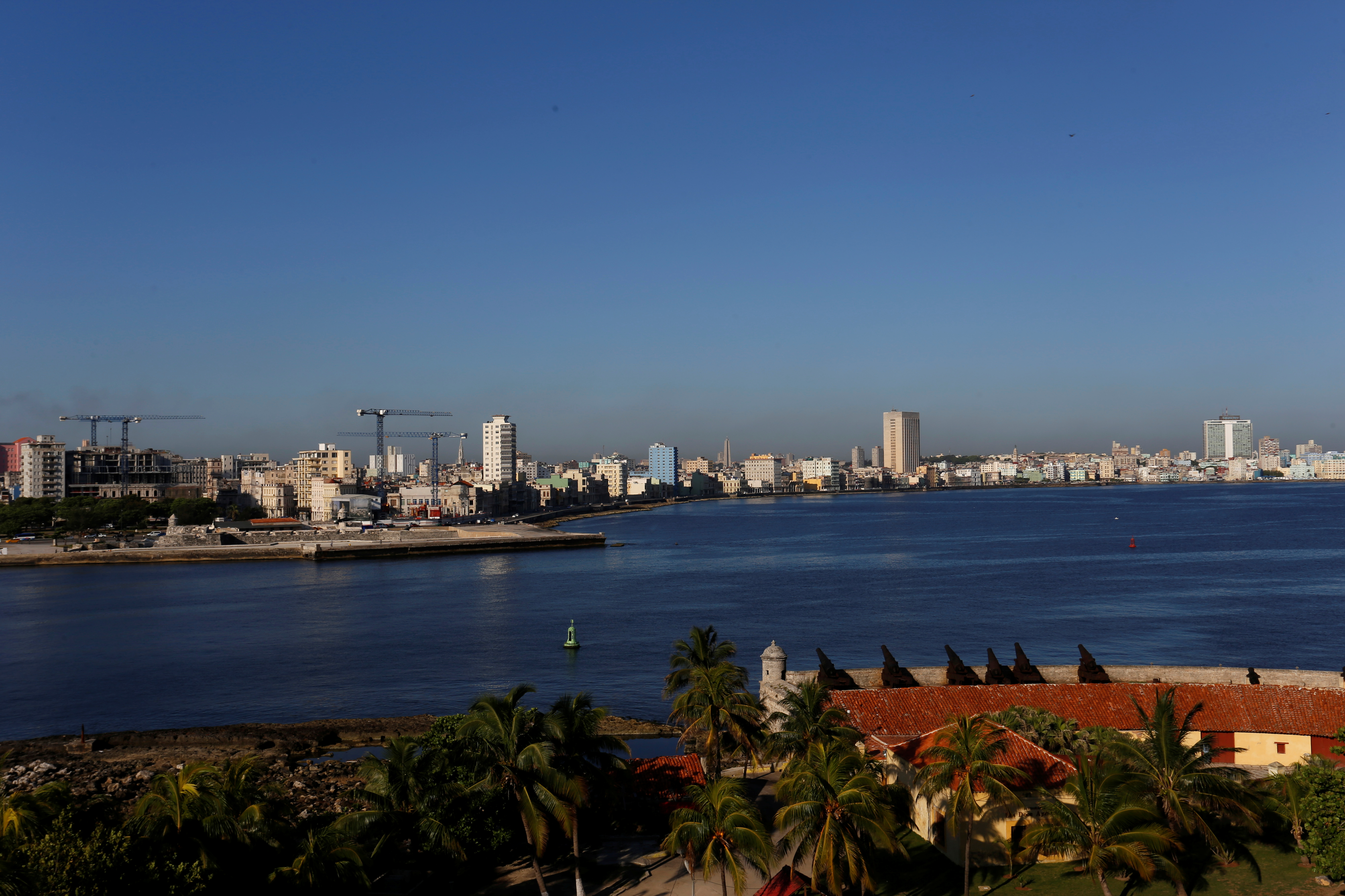 Cranes dot the skyline as the building of luxury hotels and the renovation of historic buildings are underway, in Havana