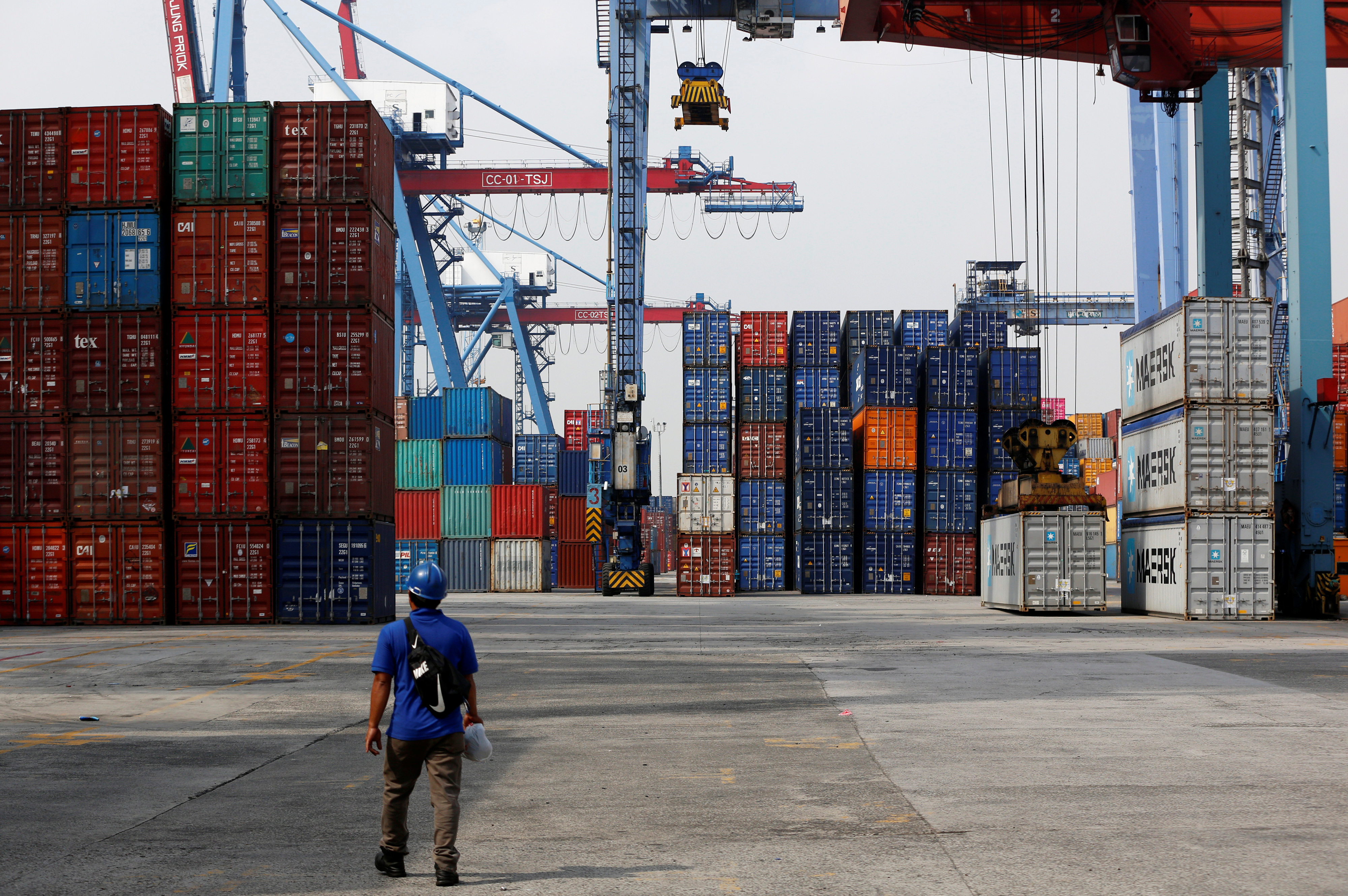 A worker walks on the dock of the Tanjung Priok Port in Jakarta
