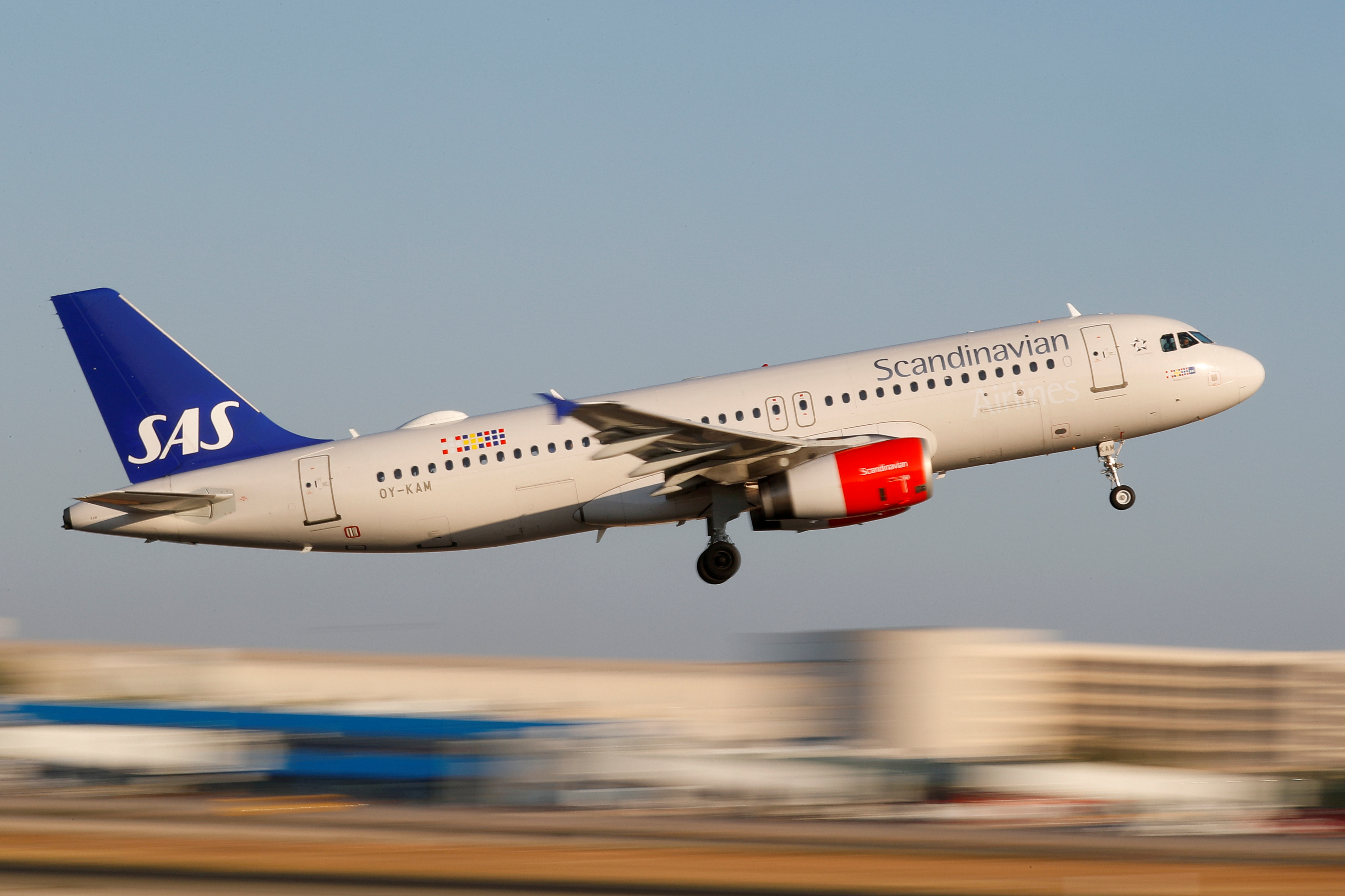 A SAS Airbus A320 airplane takes off from the airport in Palma de Mallorca