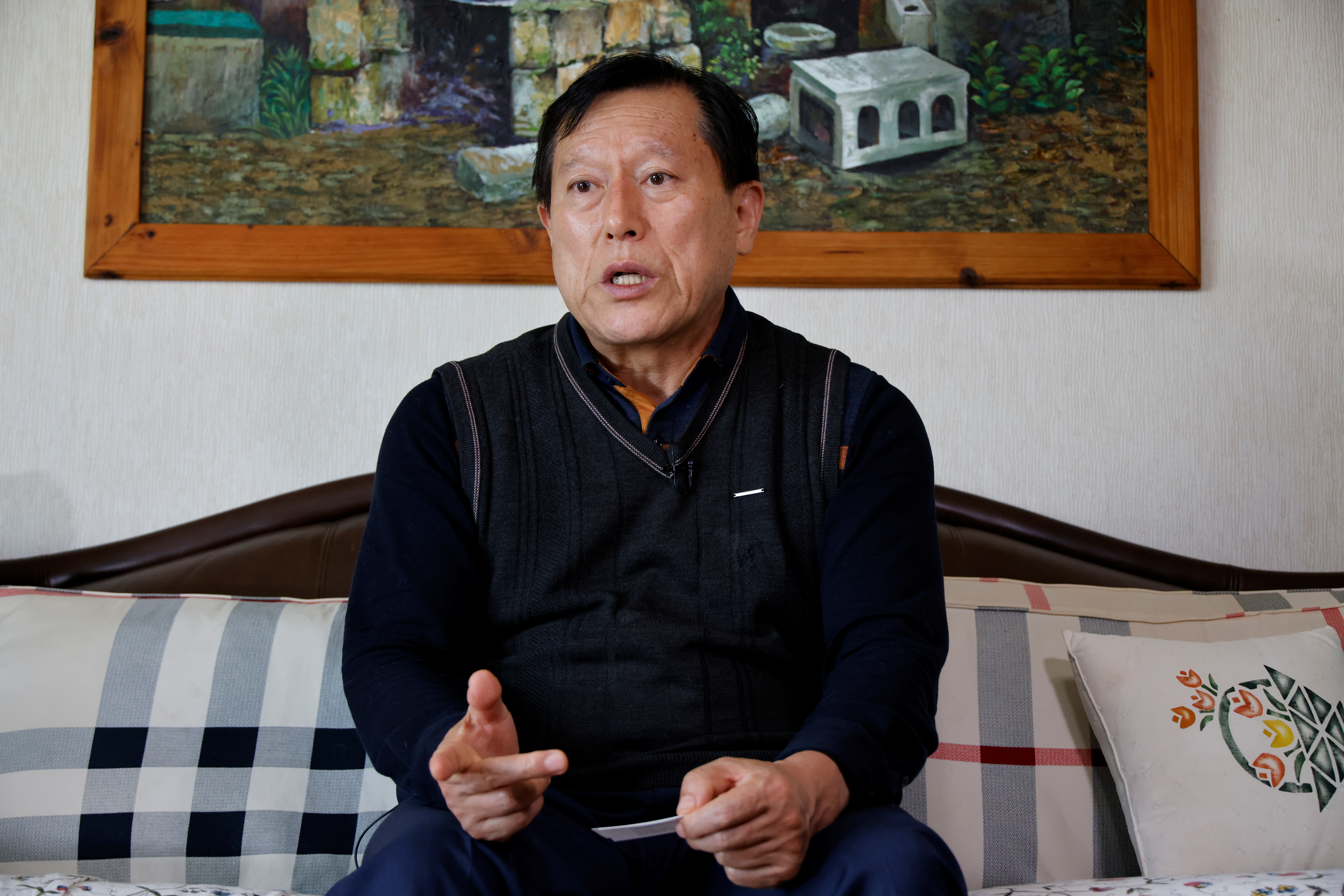 Kim Gwang-ho, a former Hyundai Motor engineer, speaks during an interview with Reuters at his home in Seoul