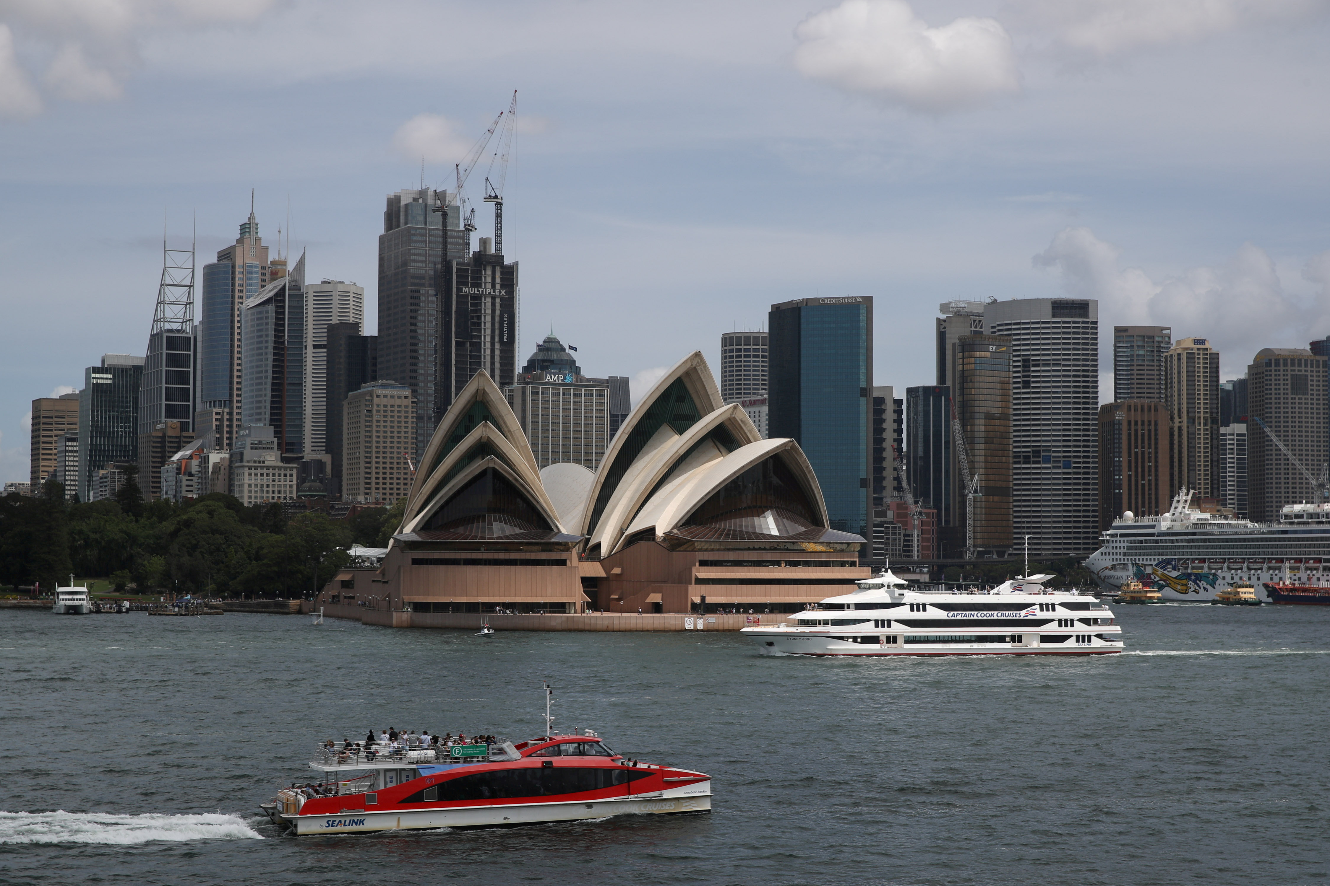 The Sydney Opera House and city centre skyline are seen in Sydney