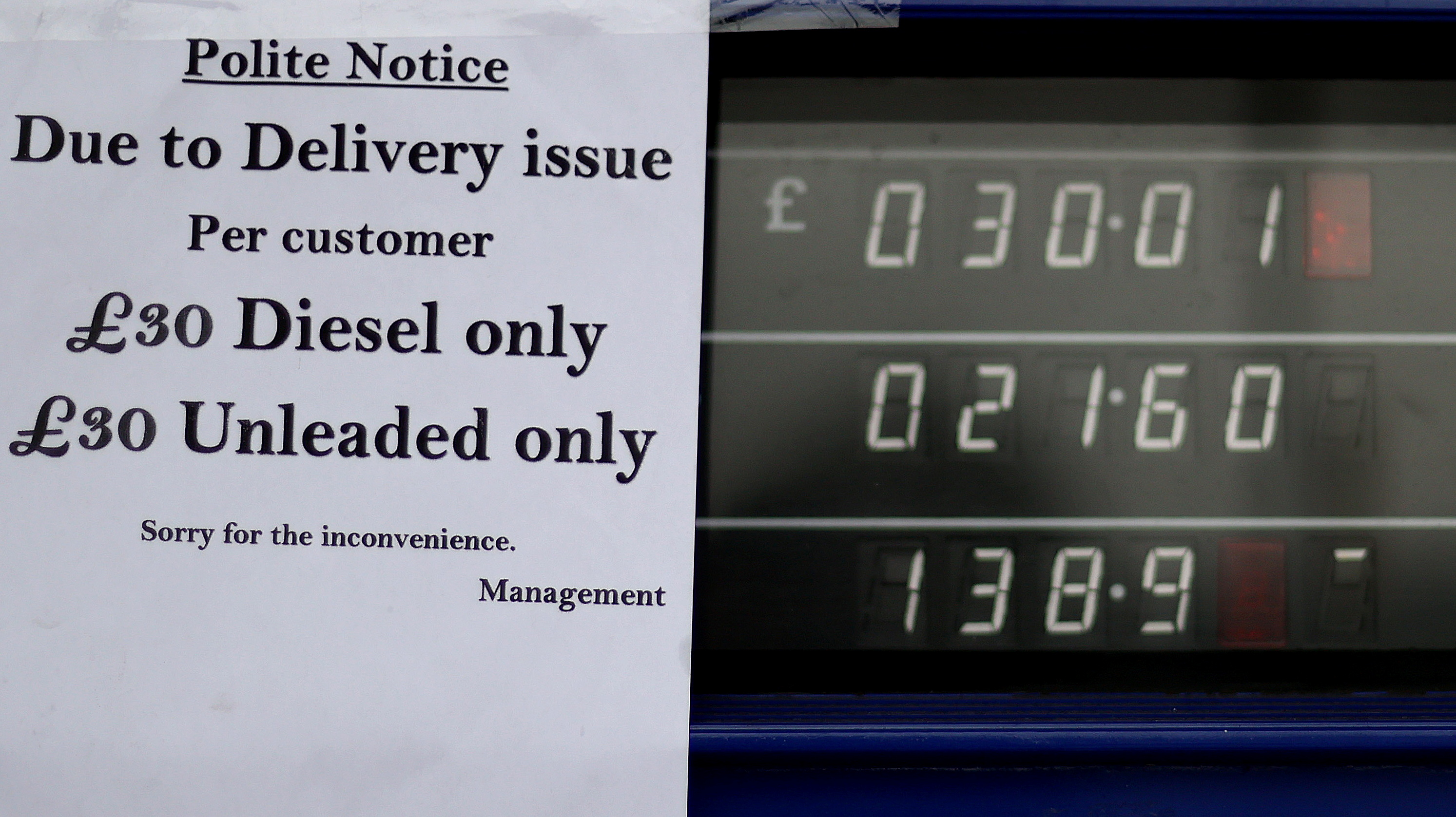 A sign shows customers that fuel has run out at a petrol station
