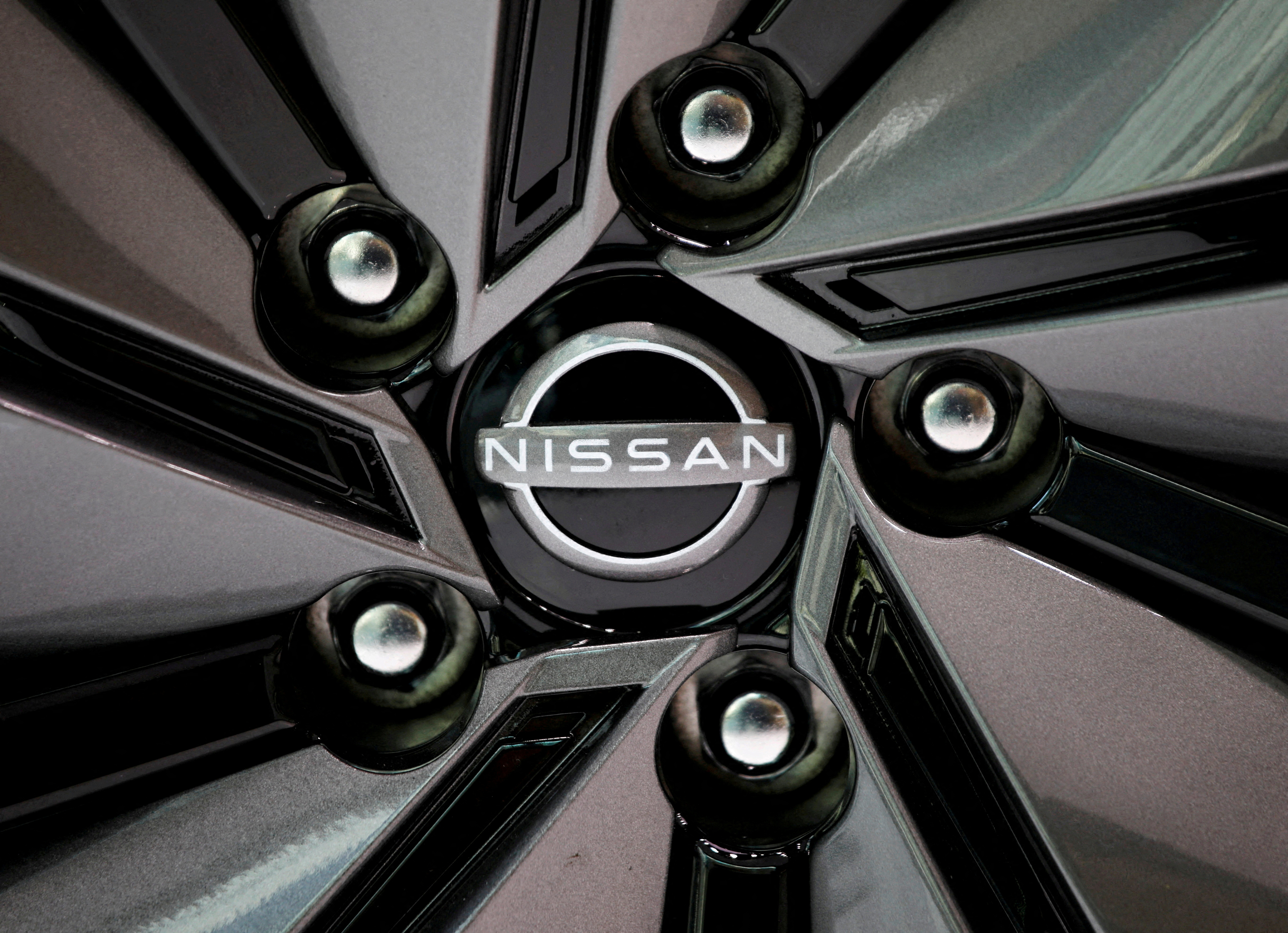 The logo of Nissan Motor is seen on a car wheel at the automaker's showroom in Tokyo