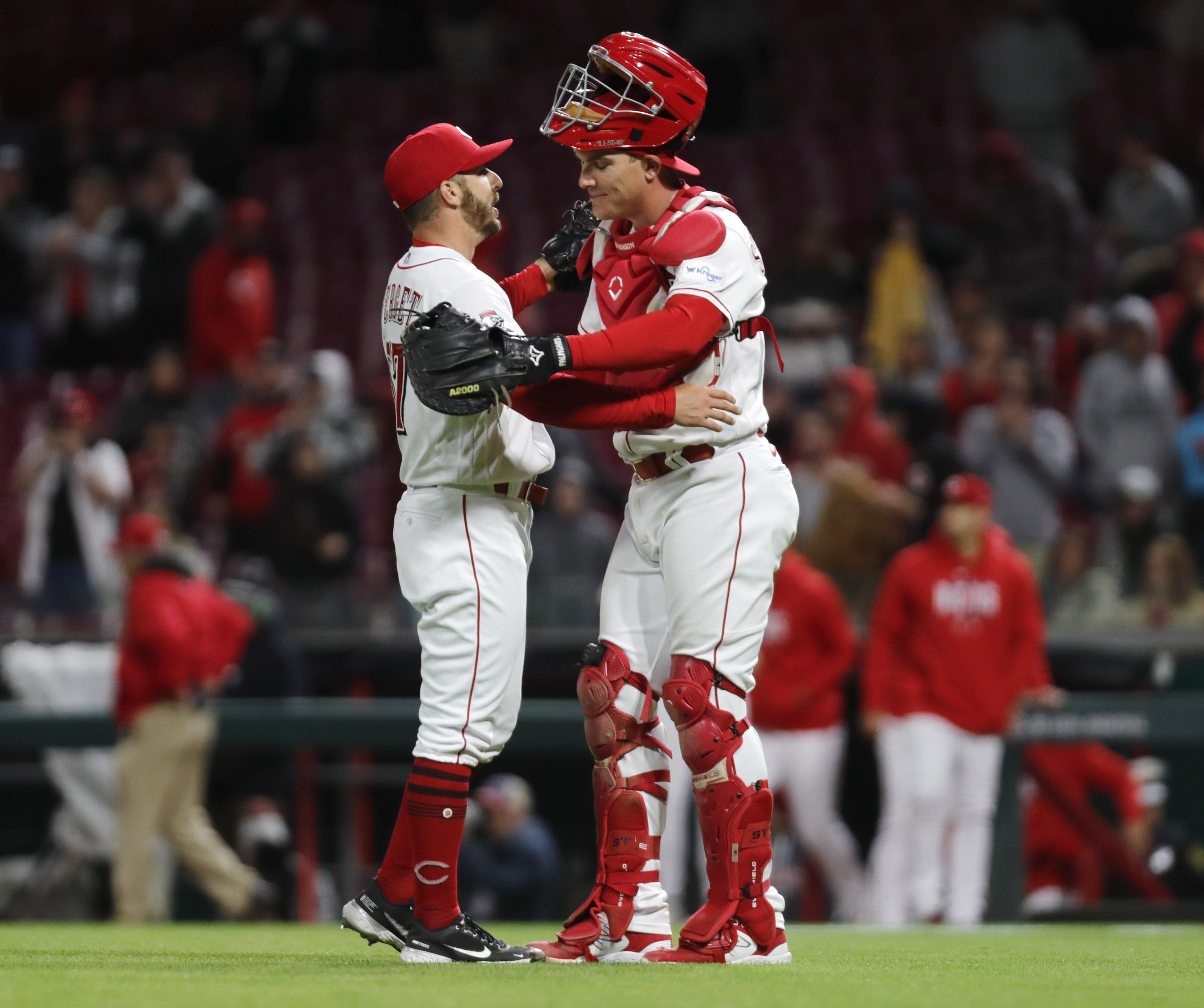 Cincinnati Reds' Stuart Fairchild (17) reacts after scoring on a