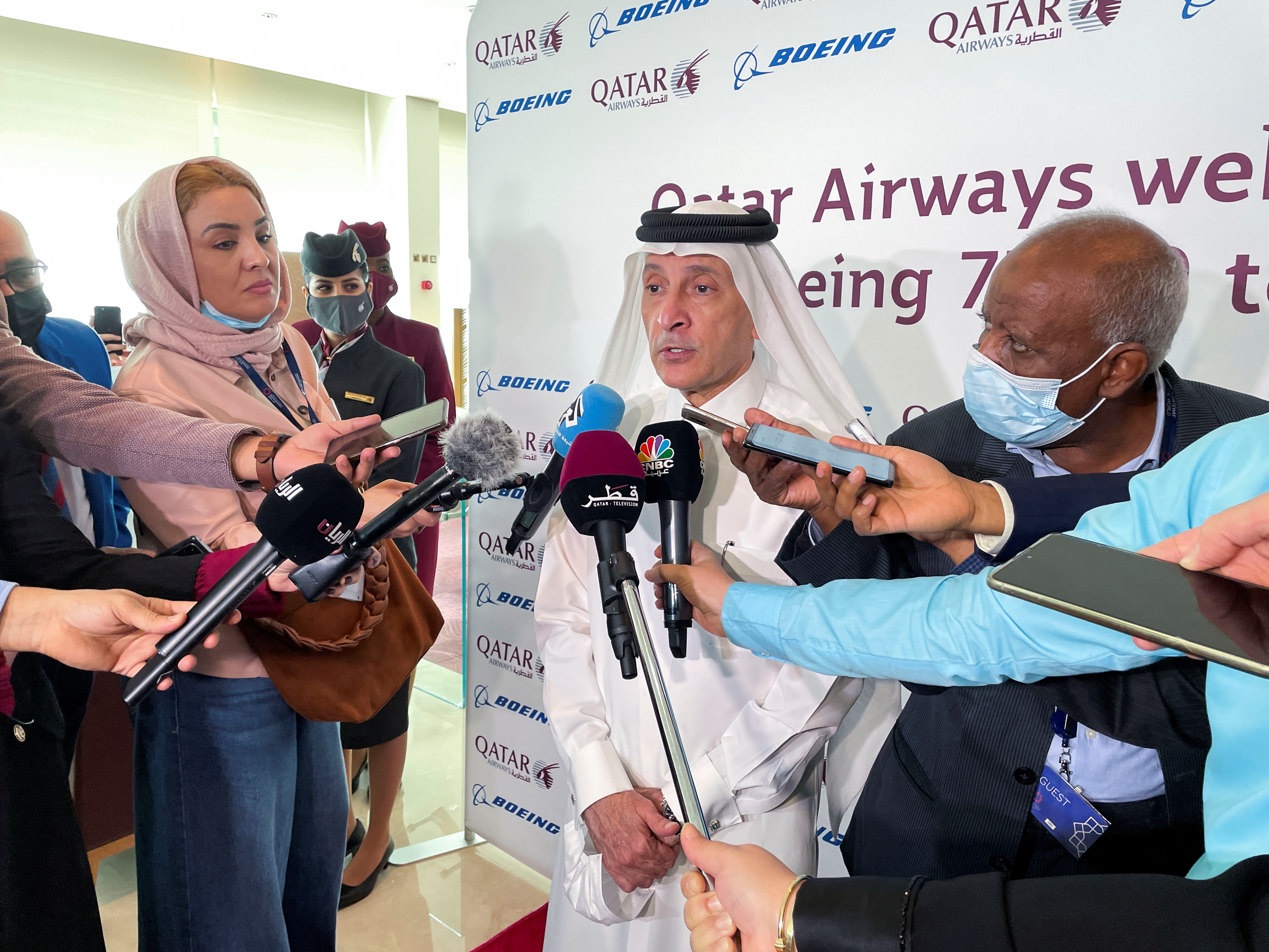 Qatar Airway's Chief Executive Officer, Akbar Al Baker speaks to reporters alongside a preview of the Boeing 777X jetliner at Doha International Airport, in Doha