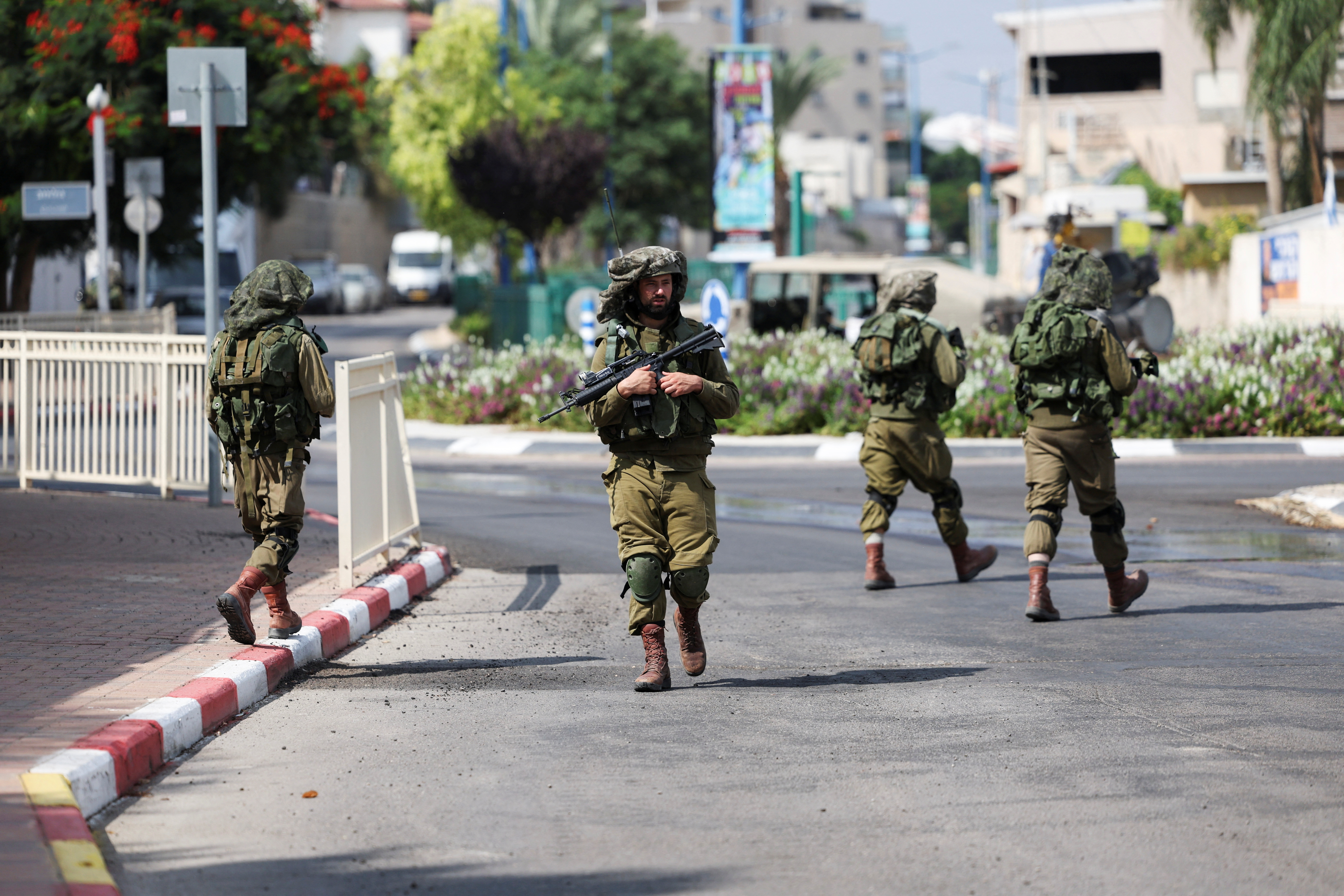 Israeli soldiers patrol following a mass-infiltration by Hamas gunmen from the Gaza Strip, in Sderot