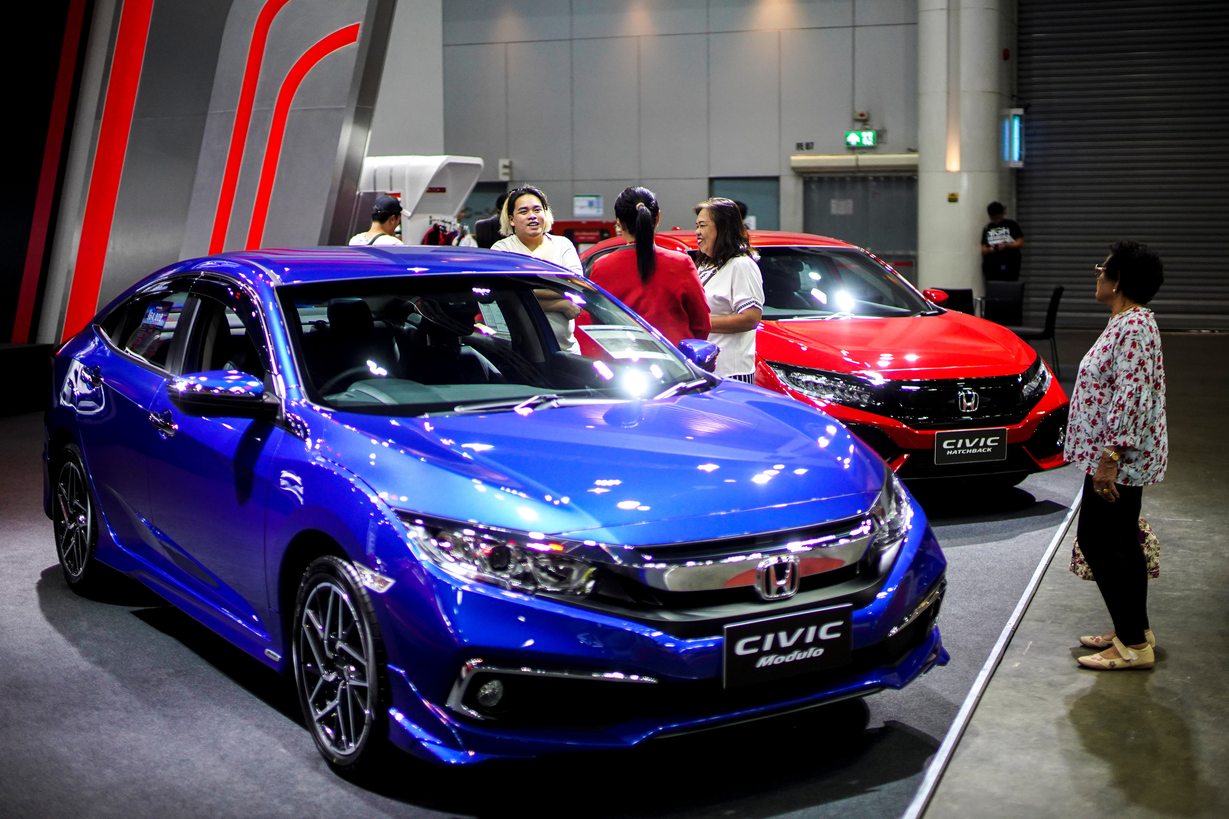 Visitors look at Honda cars during Bangkok Auto Salon 2019 in Bangkok