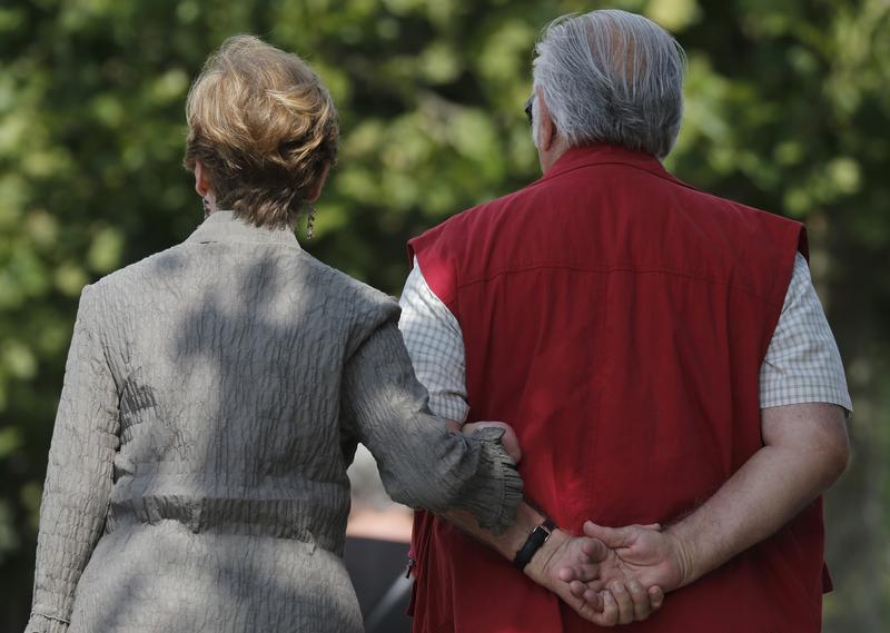 A retired couple take a stroll in Enghien-les-Bains