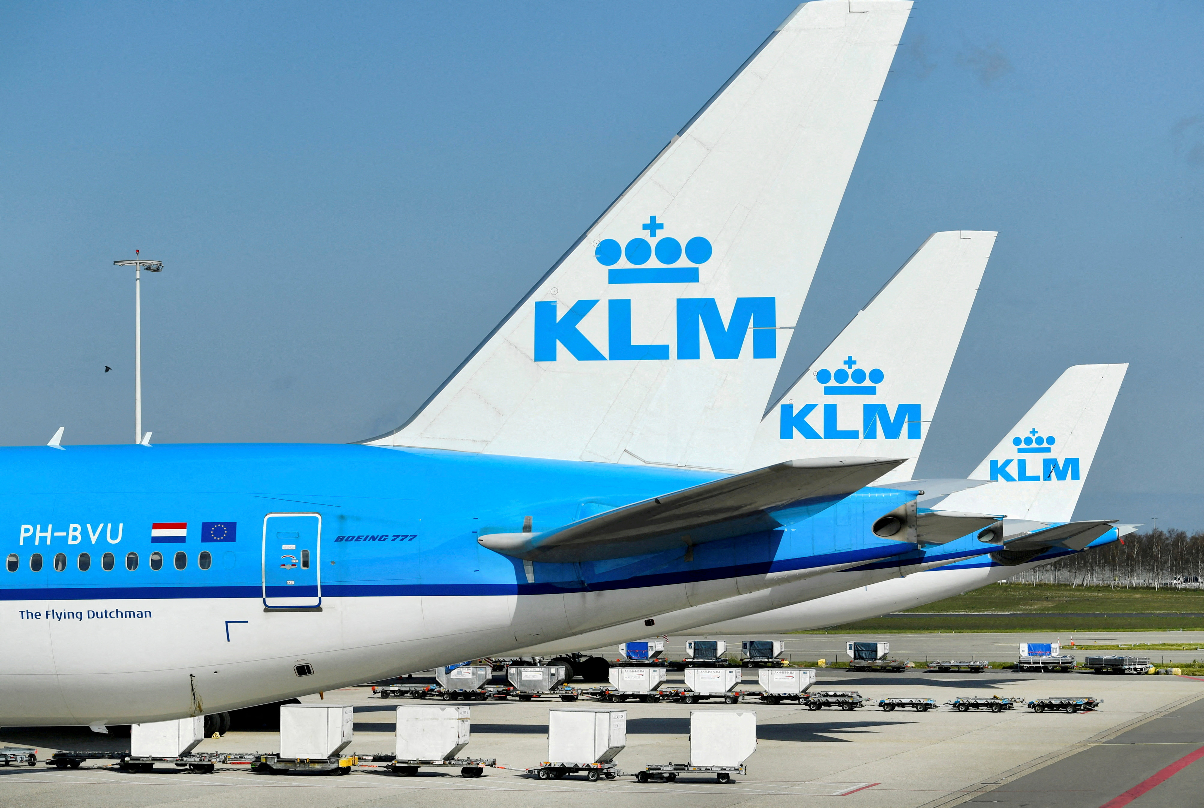KLM airplanes are seen parked at Schiphol Airport
