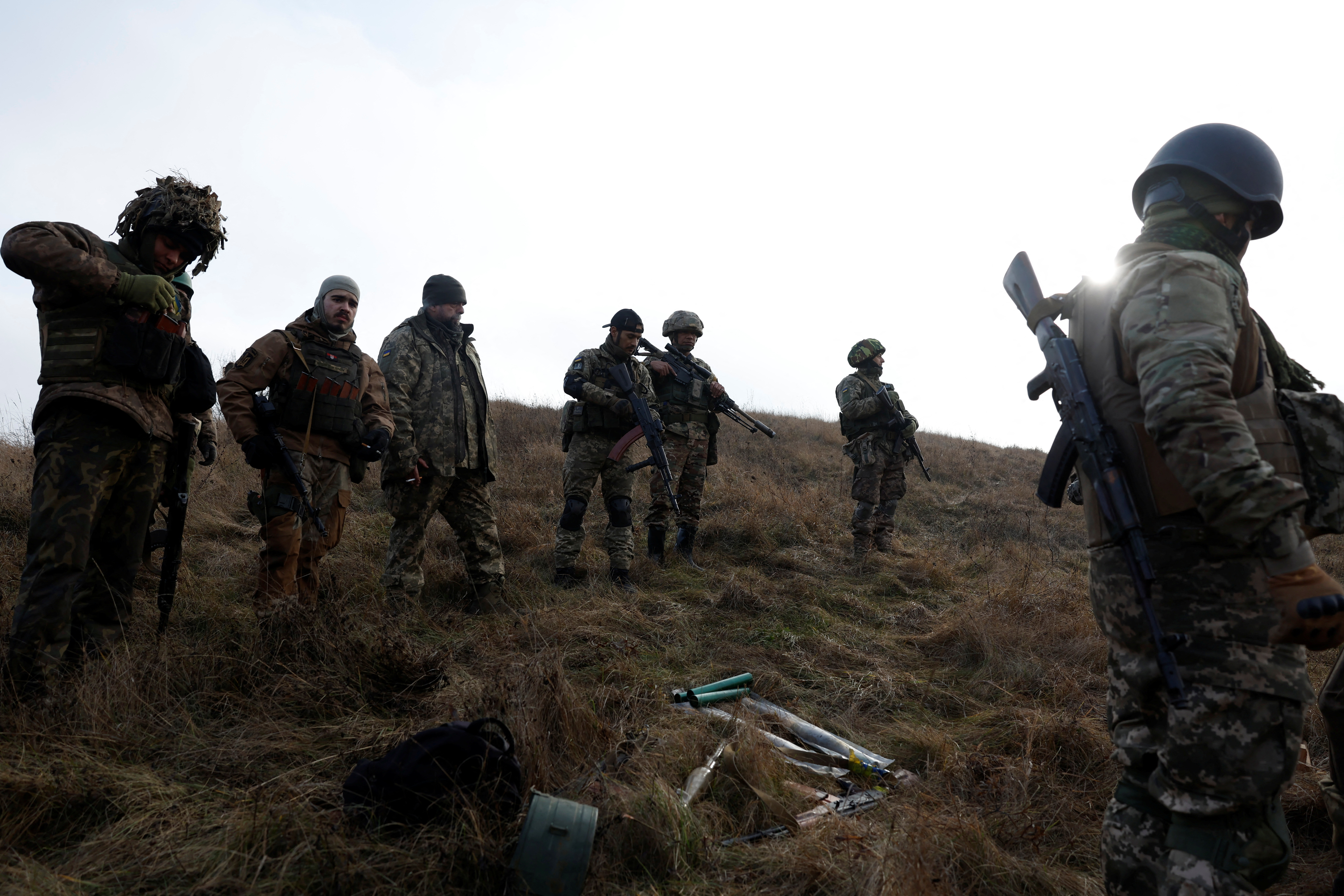 Soldiers from Carpathian Sich international battalion conduct manoeuvres near the front line, in Kreminna