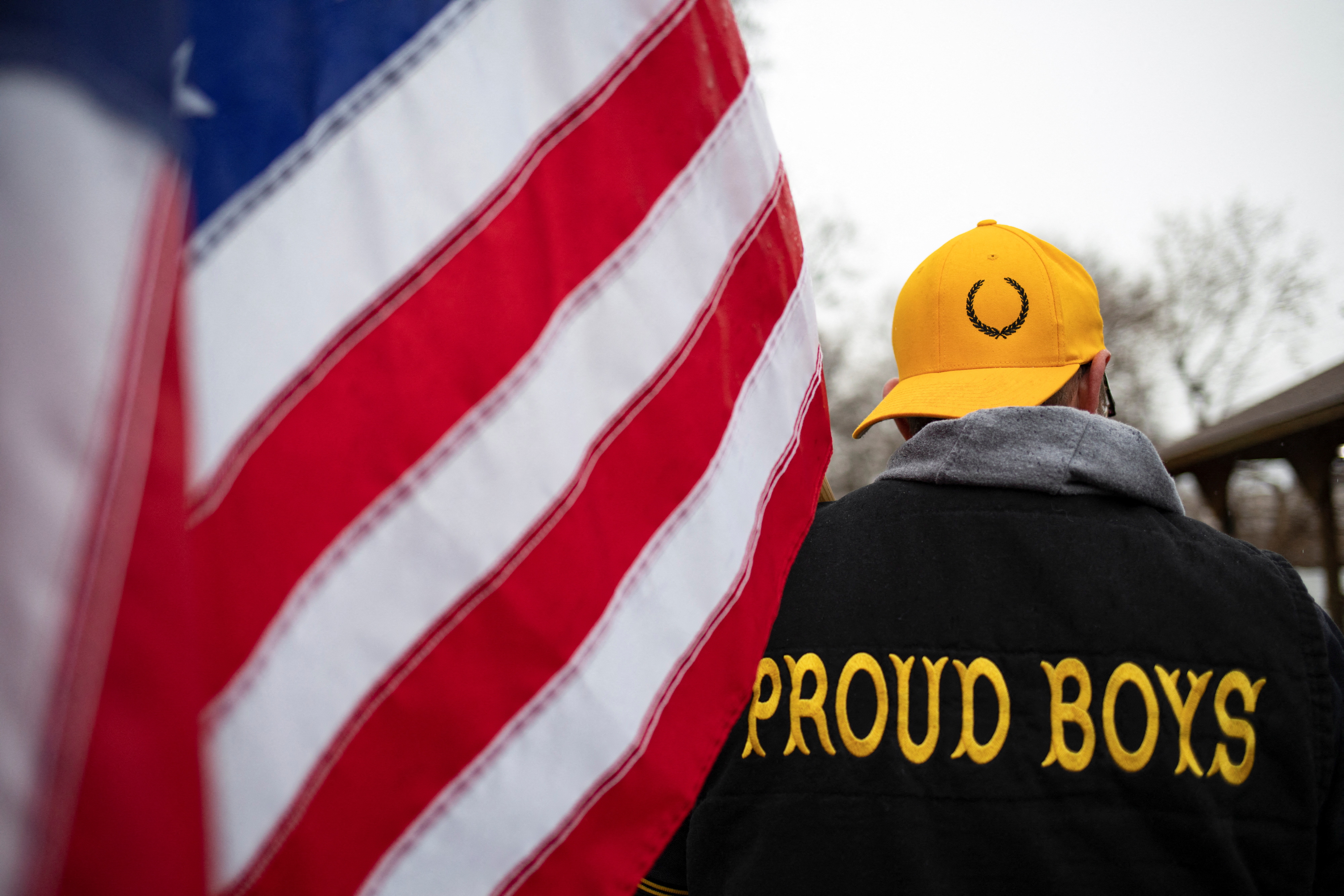 A member of the Proud Boys attends a "Let's Go Brandon Festival" rally in opposition to U.S. President Joe Biden, Ortonville, Michigan, November 20, 2021.  REUTERS/Emily Elconin/Files