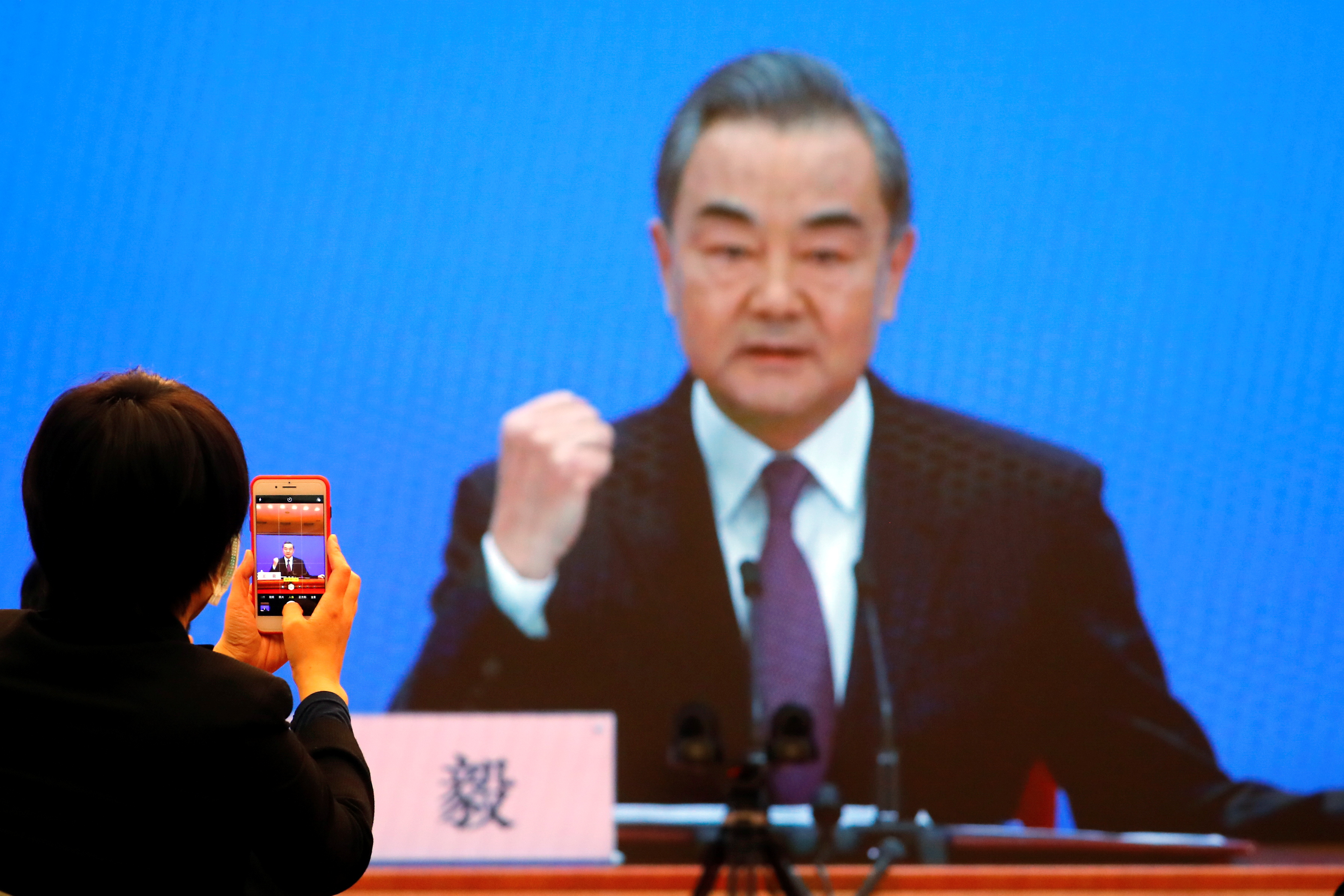 Chinese State Councillor and Foreign Minister Yi attends a news conference in Beijing