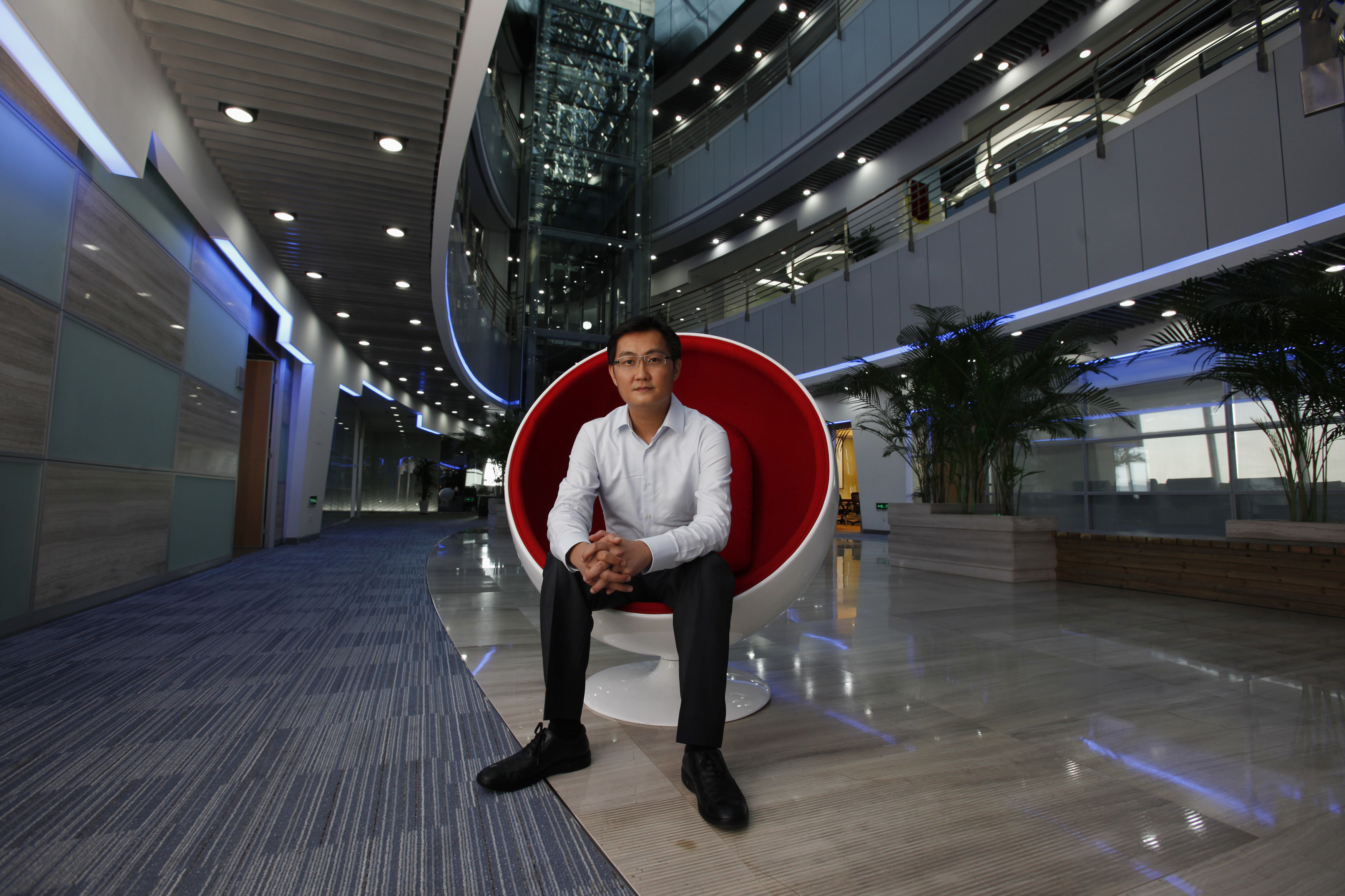Tencent Chairman and CEO Pony Ma poses at the company's headquarters in Nanshan Hi-Tech Industrial Park in the southern Chinese city of Shenzhen during an interview with Reuters June 9, 2011. Picture taken June 9, 2011.    REUTERS/Bobby Yip   (CHINA - Tags: BUSINESS SCI TECH) 