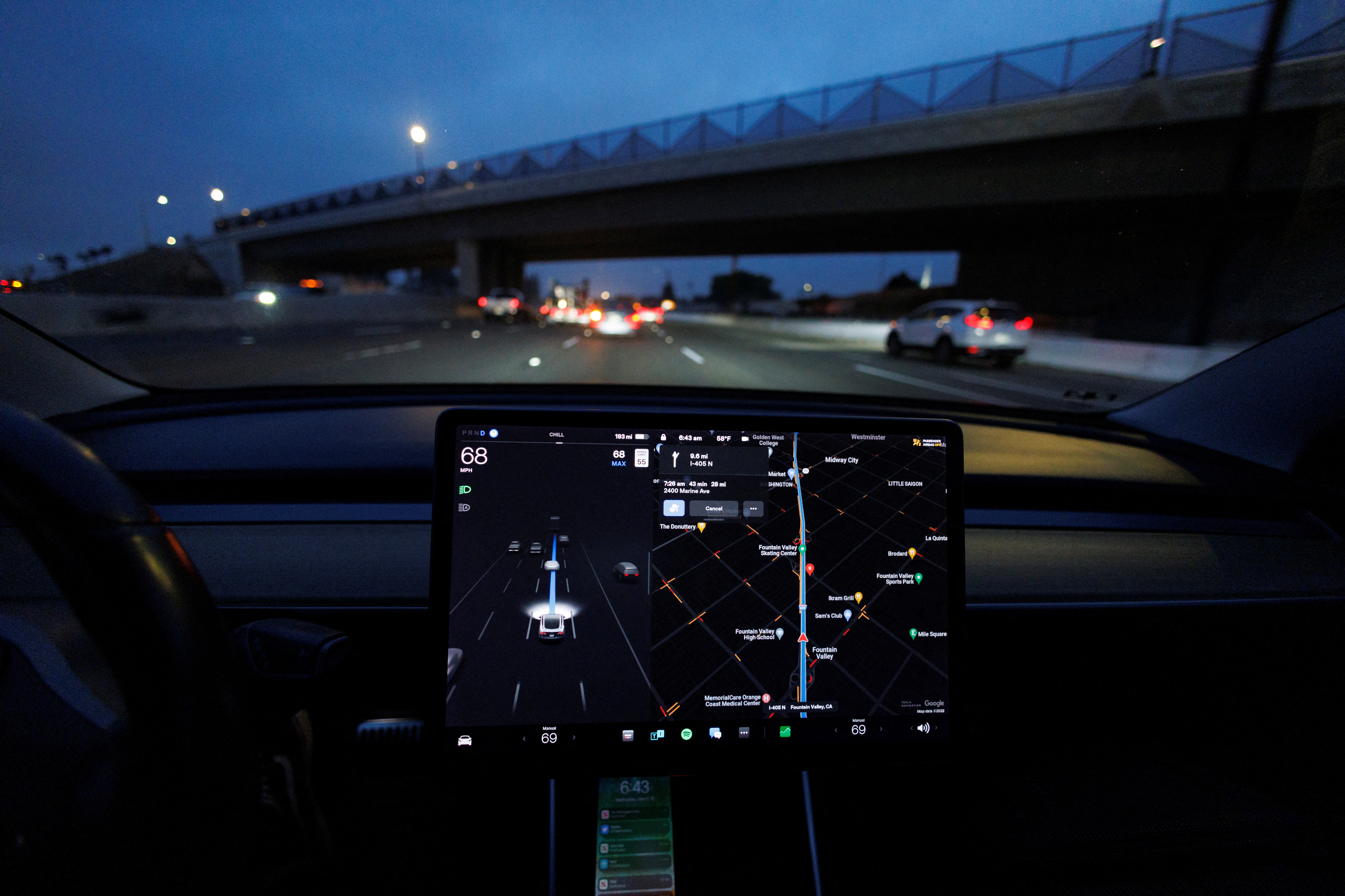 Tesla Model 3 drives on autopilot along California freeway