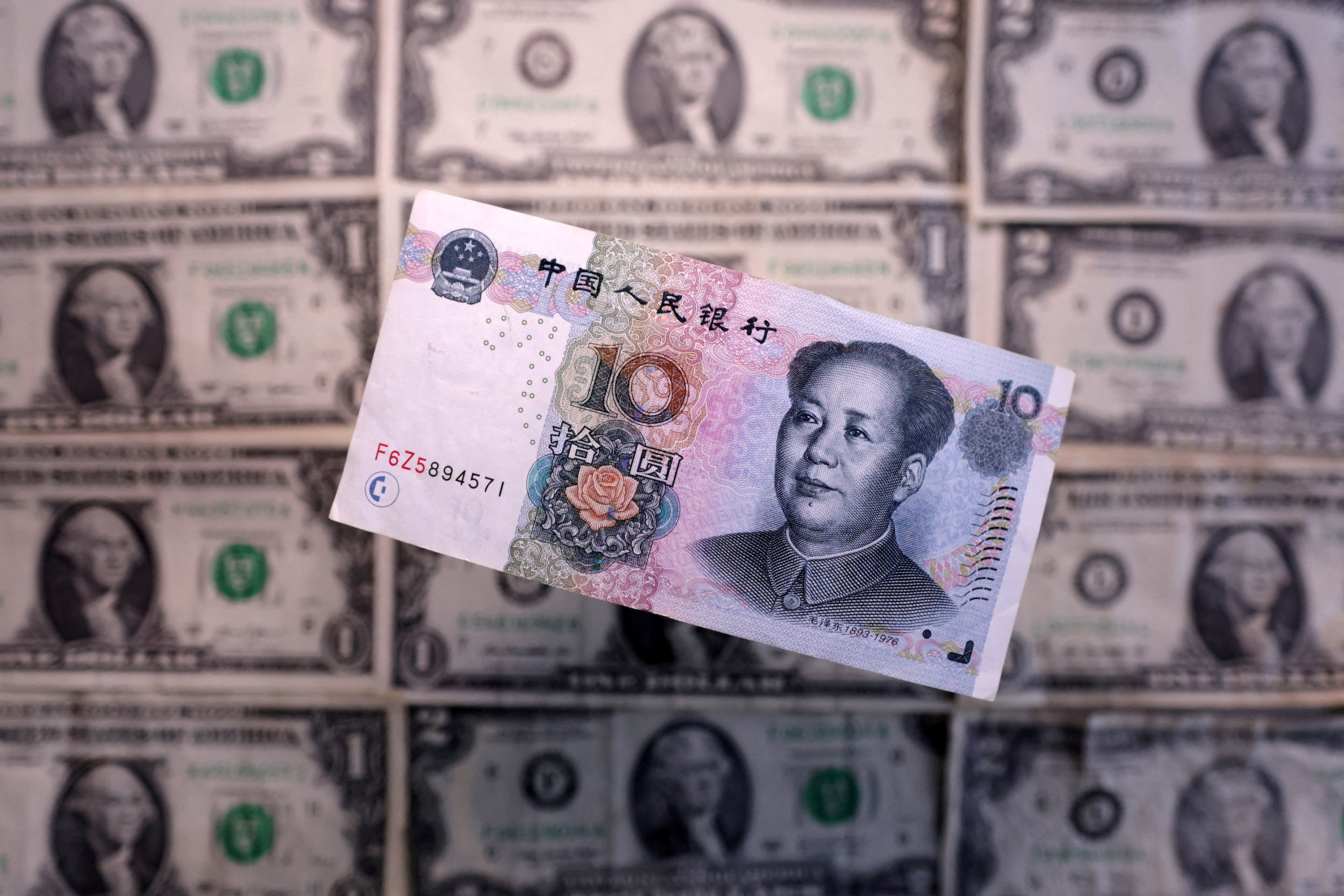Yuan falls to 2007 lows as US tariffs on China kick in | Reuters