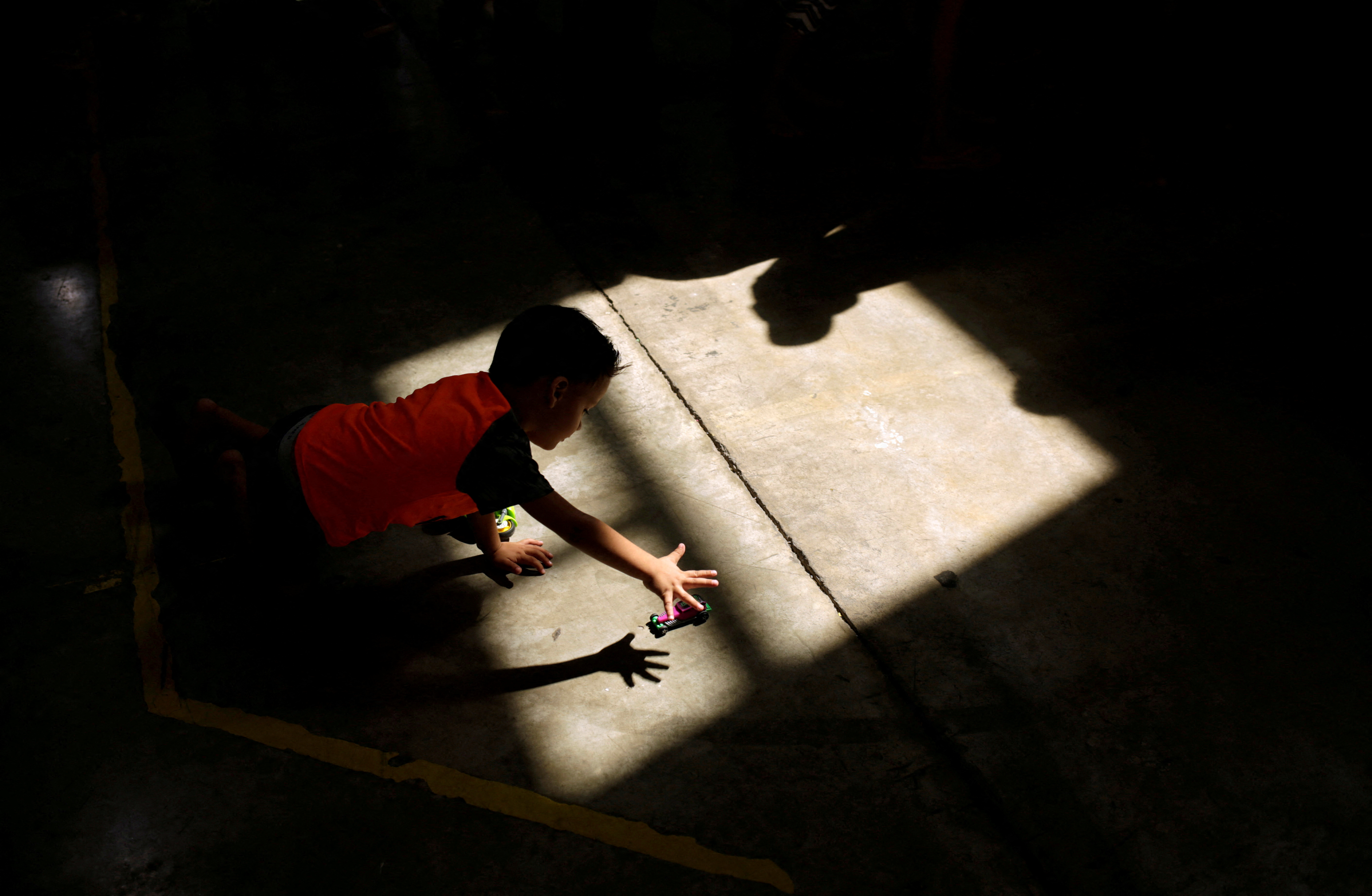 A migrant boy, who returned to Mexico with his parents from the U.S. under the Migrant Protection Protocols, plays at a migrant shelter run by the federal government in Ciudad Juarez