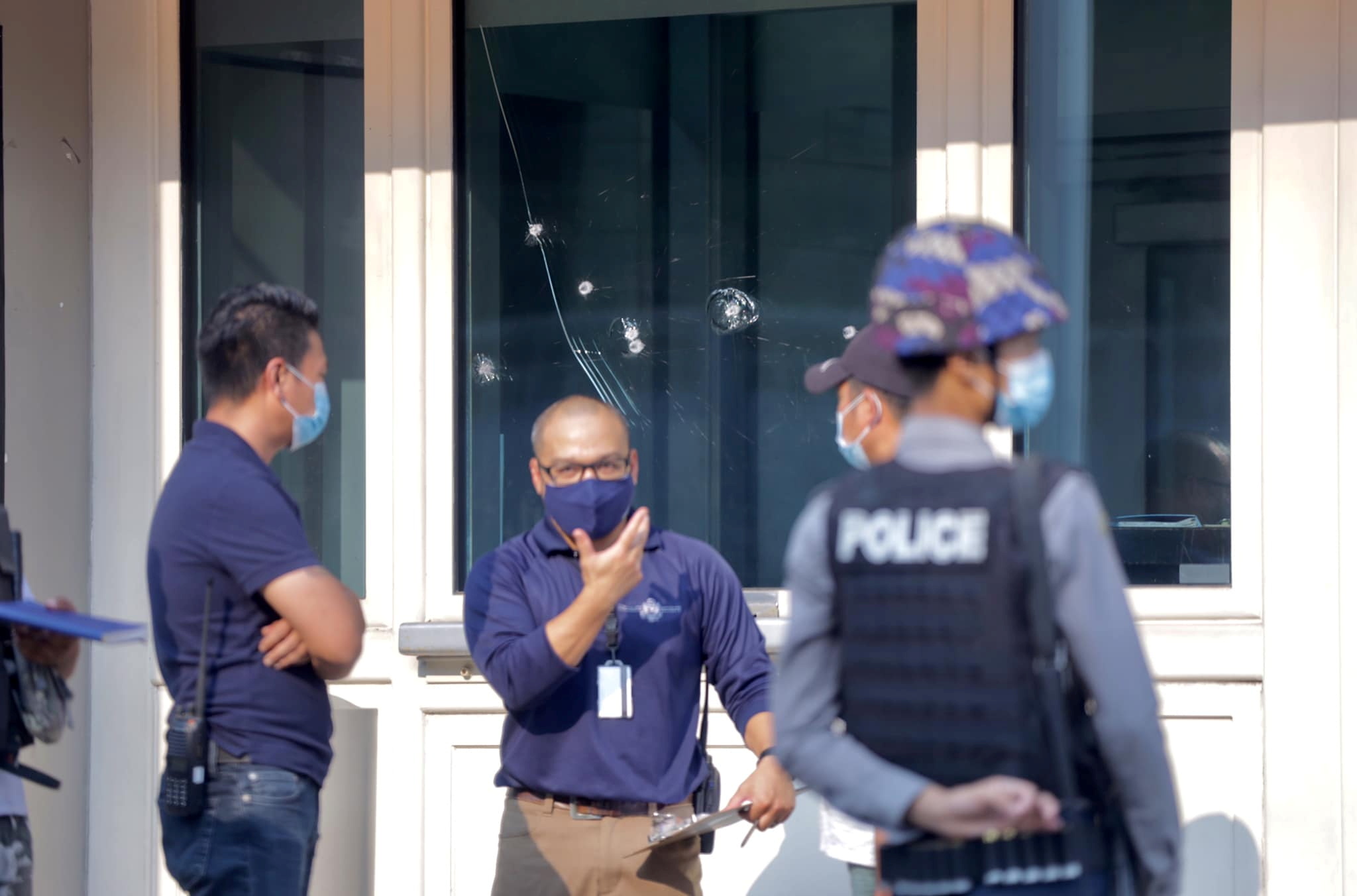 Bullet holes are seen on the window at American Center Yangon (ACY) in Yangon, Myanmar March 27, 2021 in this picture obtained by REUTERS 